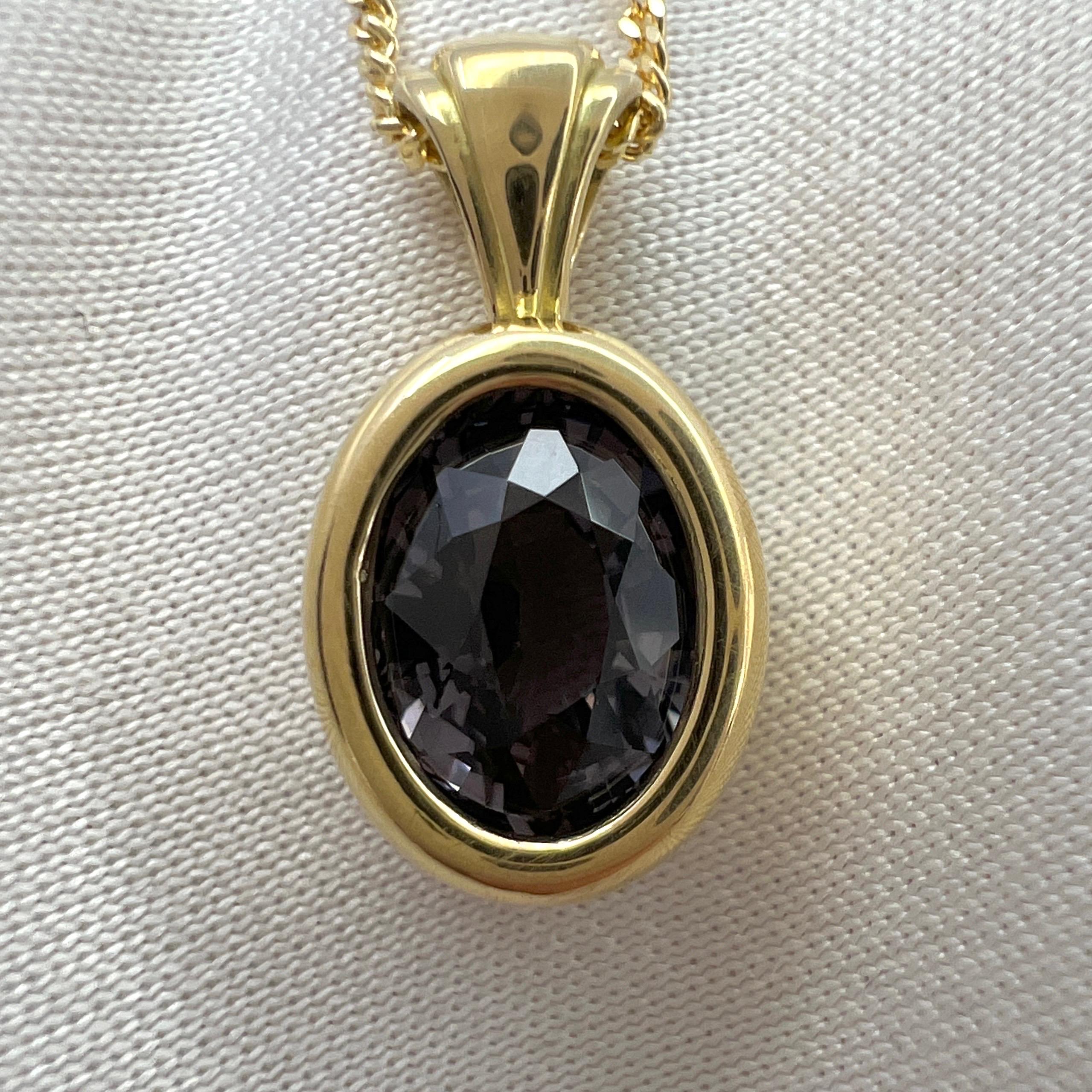 Rare Purple Gray Titanium Spinel Oval Cut 18k Yellow Gold Solitaire Pendant Necklace.

1.90 Carat spinel with a beautiful greyish blue purple colour. Often called titanium in the trade. This spinel has an excellent oval cut also with very good
