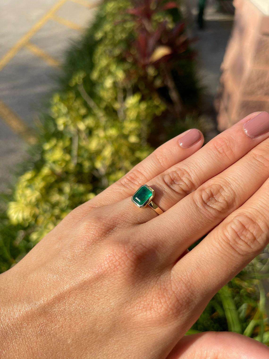 half bezel emerald cut ring