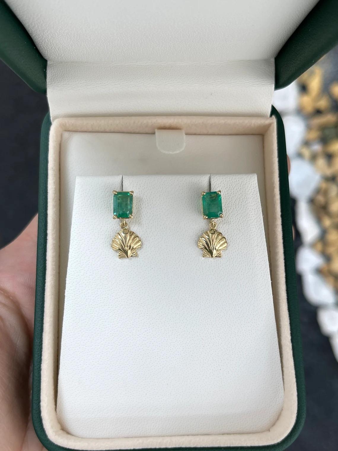 These stunning emerald stud earrings feature natural emeralds with lush green color and beautiful characteristics. The emeralds are expertly cut in an emerald cut style and securely set in a four-prong basket setting, showcasing their brilliance.