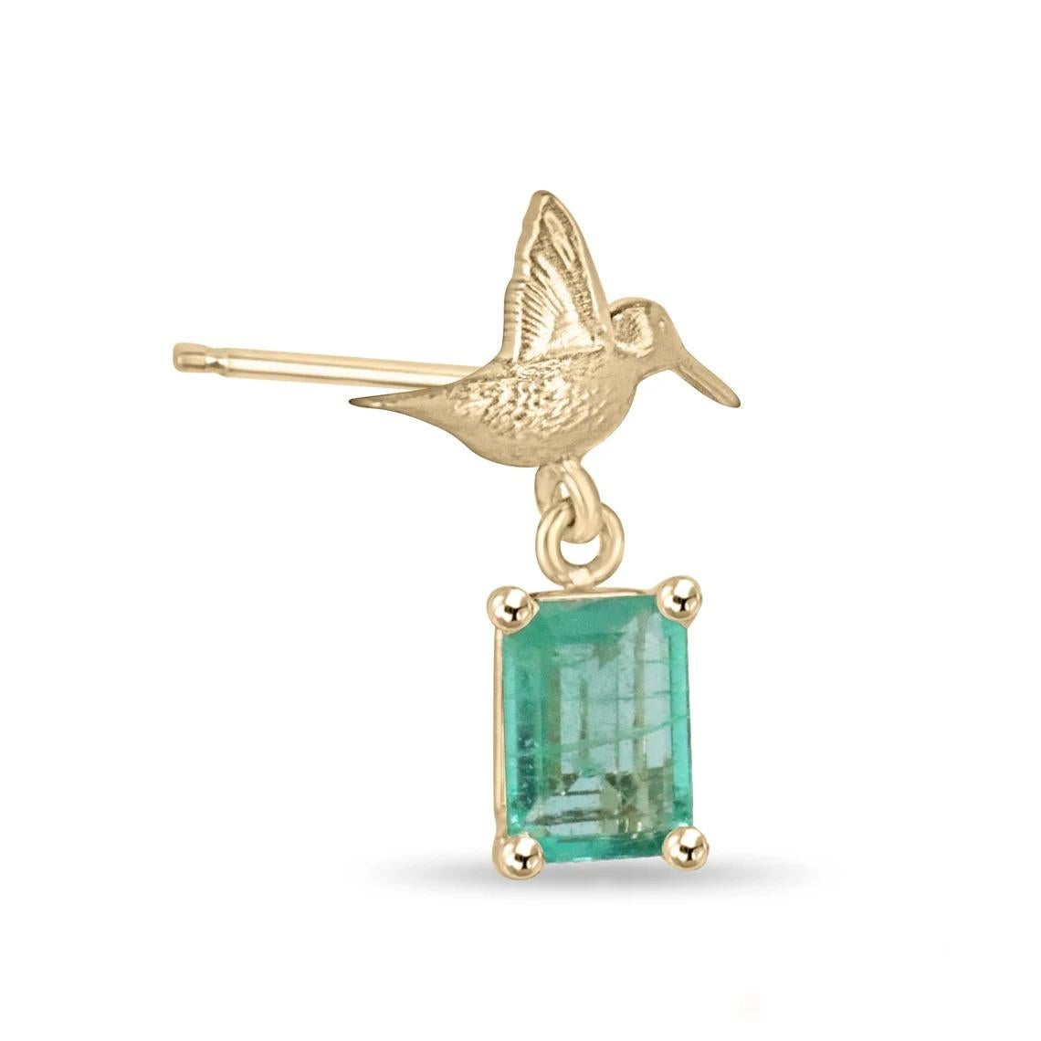 These emerald stud earrings feature captivating emeralds with a combined weight of 1.90 carats. The emeralds showcase an emerald cut, displaying a medium green color and unique characteristics that add to their allure. Set in a secure four-prong