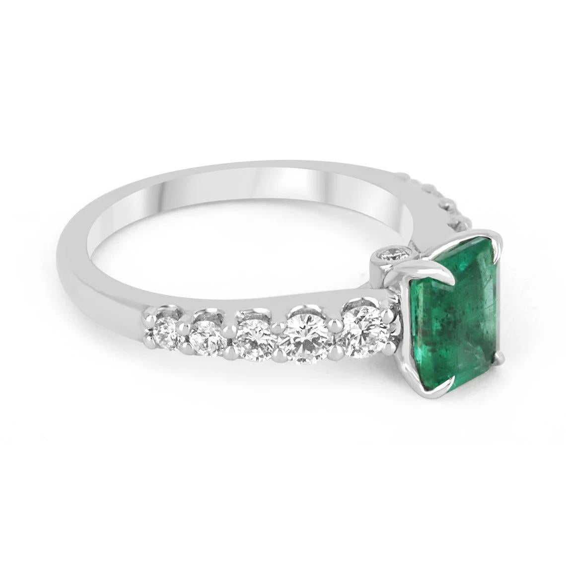 Elegantly displayed is a natural emerald-cut emerald and diamond ring. The center gem is a beautiful quality, emerald cut, emerald filled with life and brilliance! Among the emeralds, impressive qualities are their vibrant color and beautiful eye