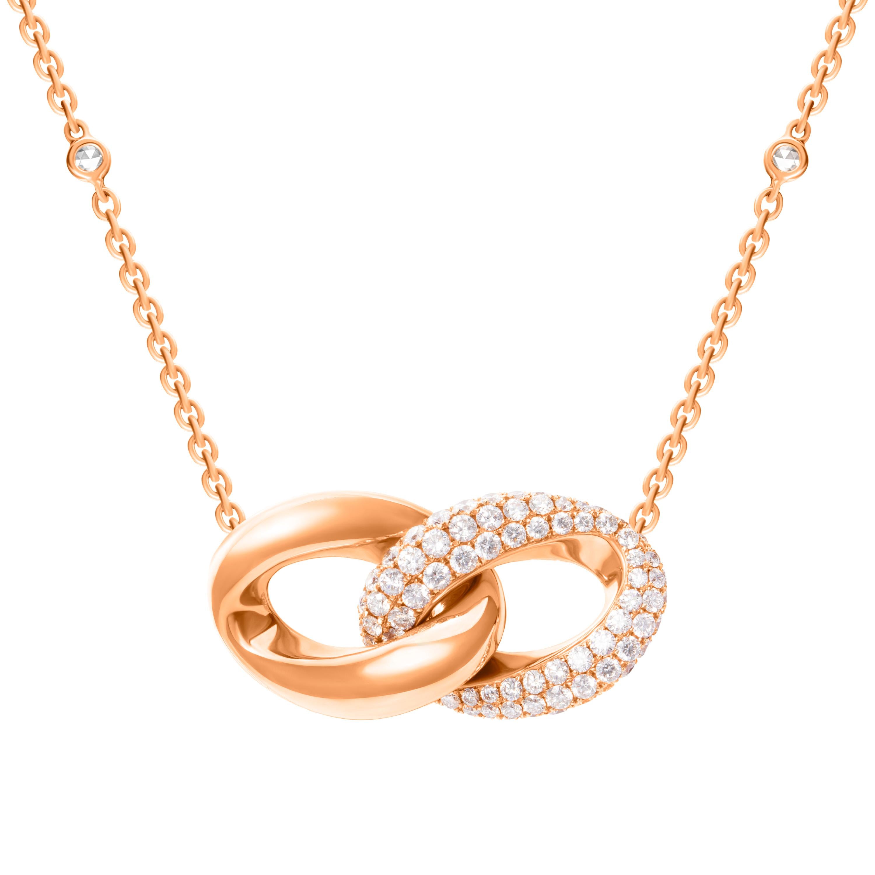 Defined by sleek curves and contours, this delicate necklace features a duo of interlocking loops in 18-karat rose gold and 1.55 carats of pavé-set diamonds.  The cable chain features 0.36 carats of rose cut round diamonds.  Chain length 18 inches. 