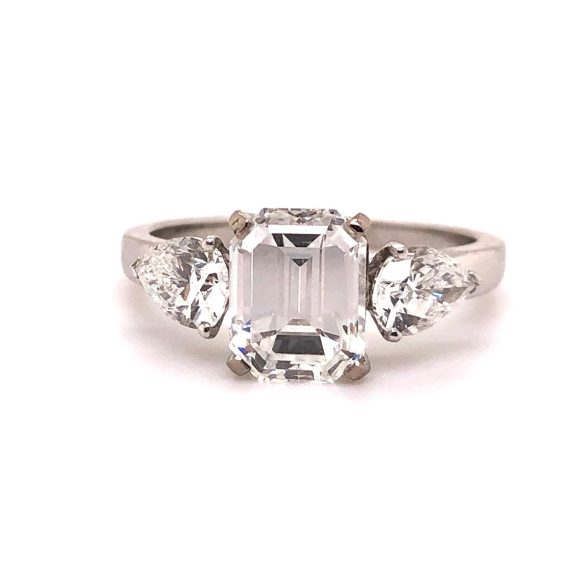 A beautiful French Diamond Ring with a very bright 1.91 carats emerald cut diamond of E VVS2 (GIA certified) and two pear-shaped diamonds of circa 1 carats. The combination of Emerald-cut and pear-shaped diamonds make it a very special and beautiful