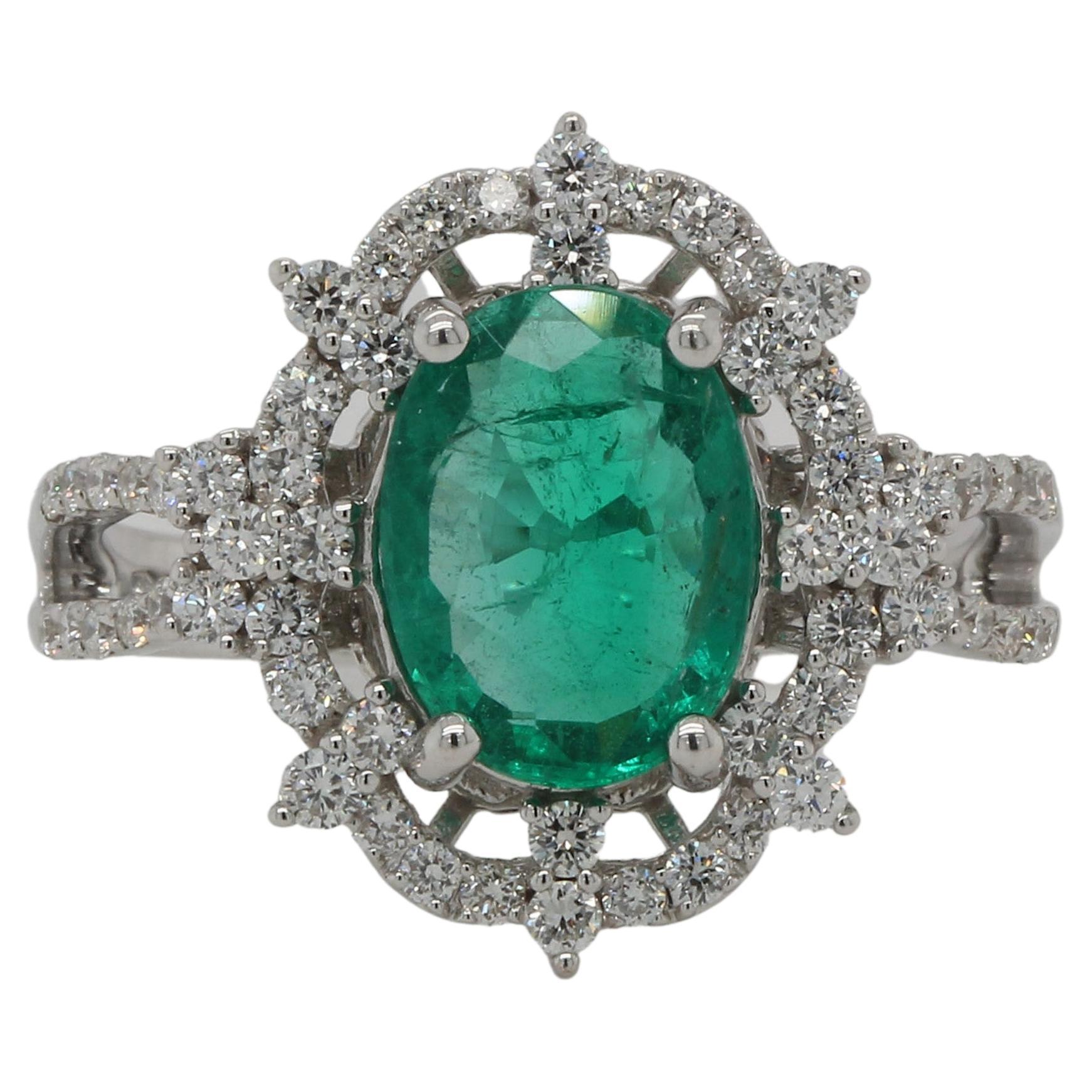 This gorgeous emerald and diamond ring is set in 18K white gold. Perfect for a birthday, anniversary or any other special occasion, it features an oval emerald that weighs 1.91 carats and is surrounded by around 0.61 carat of round diamonds. This