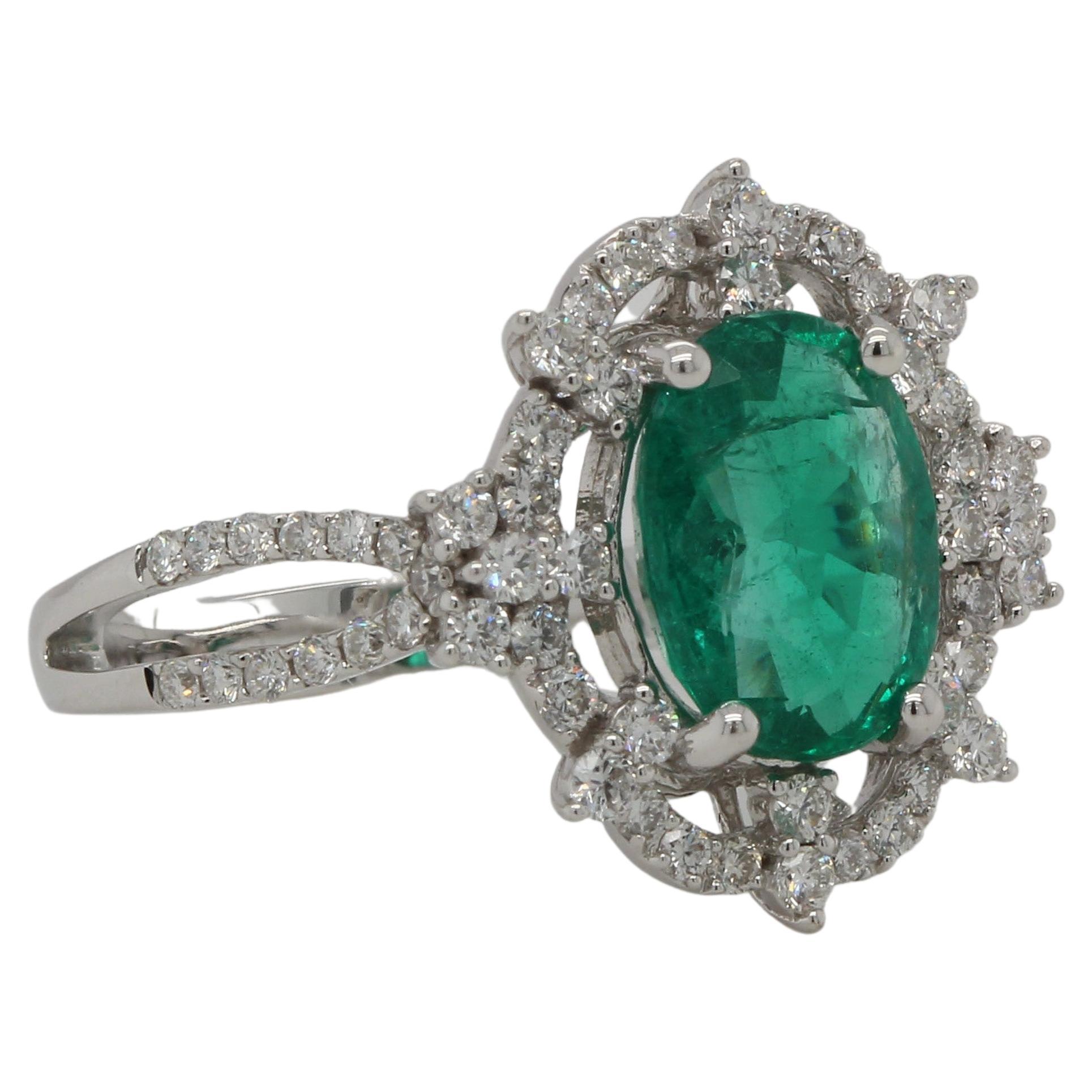 Oval Cut 1.91 Carat Emerald and Diamond Ring in 18 Karat Gold For Sale