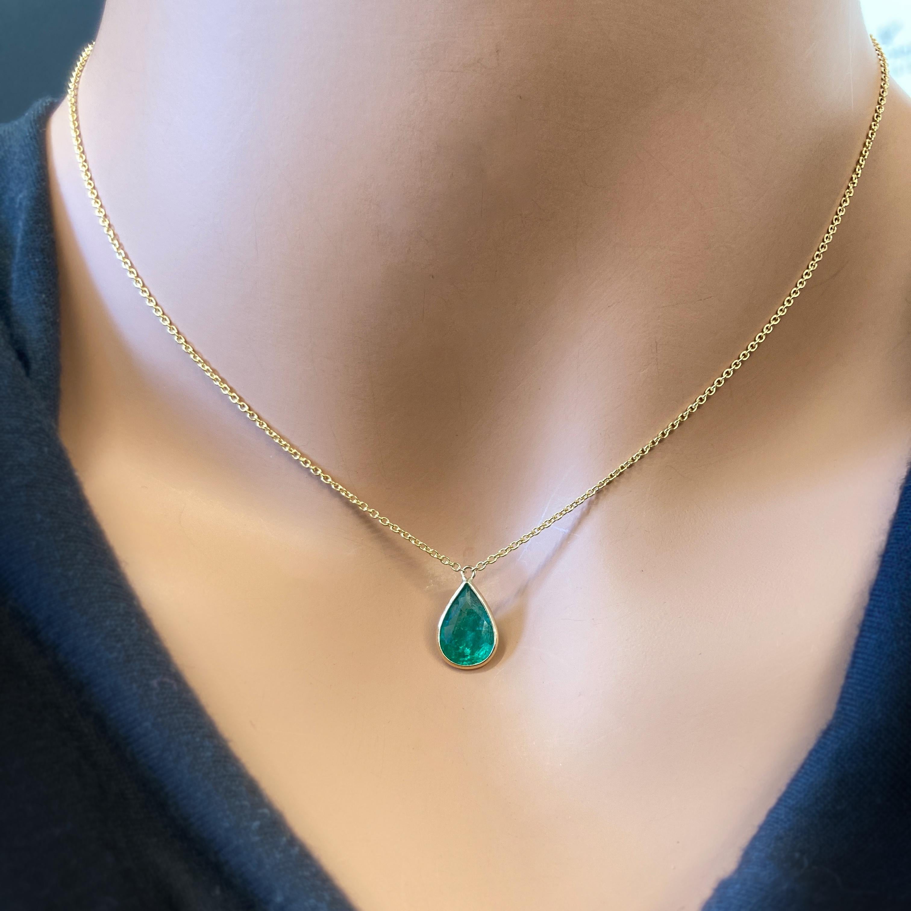 This necklace features a pear-cut green emerald with a weight of 1.91 carats, set in 14k yellow gold (YG). Emeralds are highly prized for their rich green color, and the pear cut, with its distinctive teardrop shape, adds an elegant and unique touch