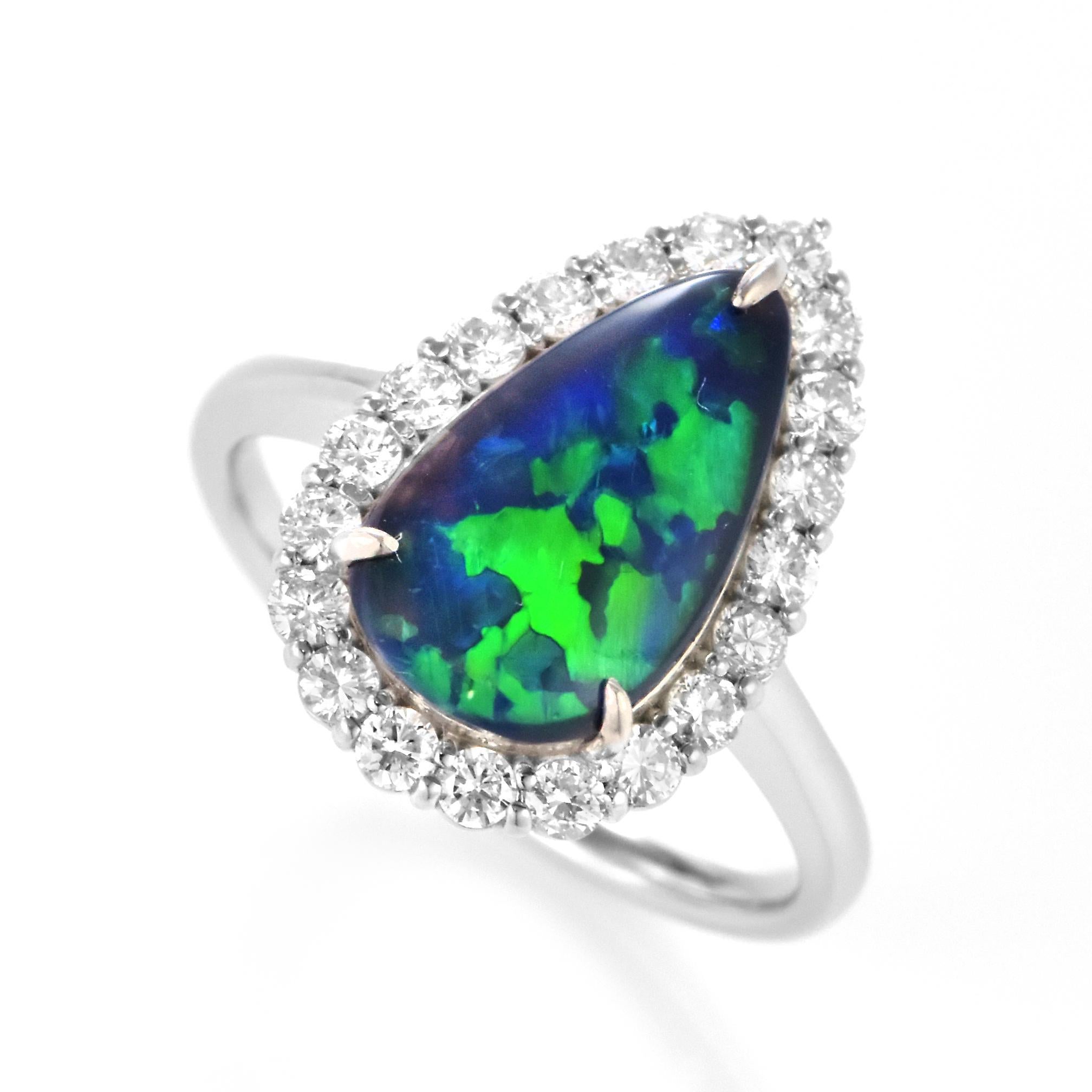 A beautiful ring featuring a 1.91 Carat Australian Black Opal and 0.58 Carat Diamonds made in Platinum. The Opal displays very good play of color! Opals are known for exhibiting flashes of rainbow colors known as 