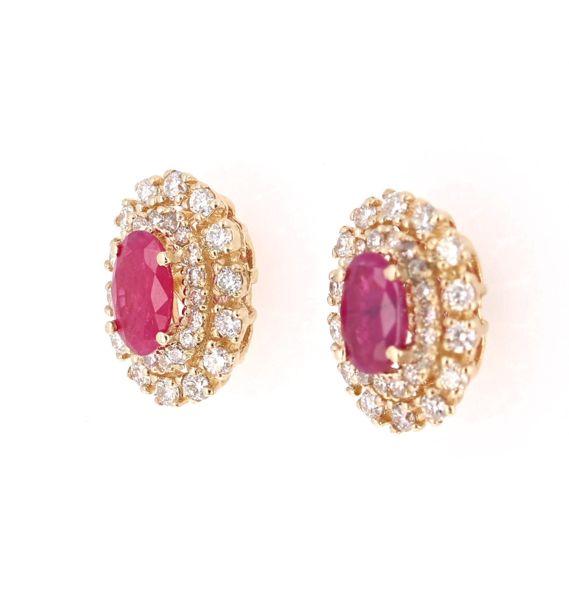 These absolute beauties have 2 Natural Rubies that weigh 1.26 Carats and are surrounded by 64 Round Cut Diamonds that weigh 0.65 Carats. (Clarity: VS, Color: H)

They are made in 14 Karat Yellow Gold and weigh approximately 2.3 grams. The setting of