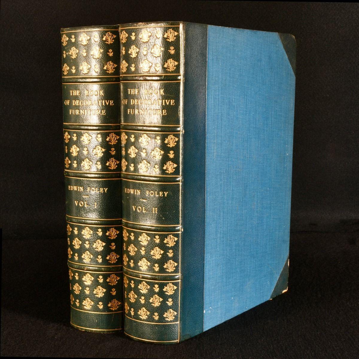 The two volume first edition of Edwin Foley's sumptuously illustrated study of decorative furniture, in vibrant half morocco bindings.

The first edition of this work, complete in two volumes.

Volume I illustrated with a folding table and fifty