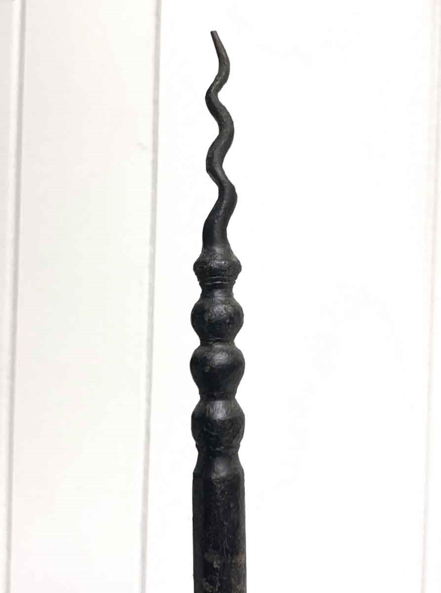 This 1910 floor lamp is in the American Craftsman design, which is an offshoot of the Arts & Crafts movement. The stand is hand forged wrought iron with simple and beautiful touches, such at the spiral at the top of the lamp, and a design on the