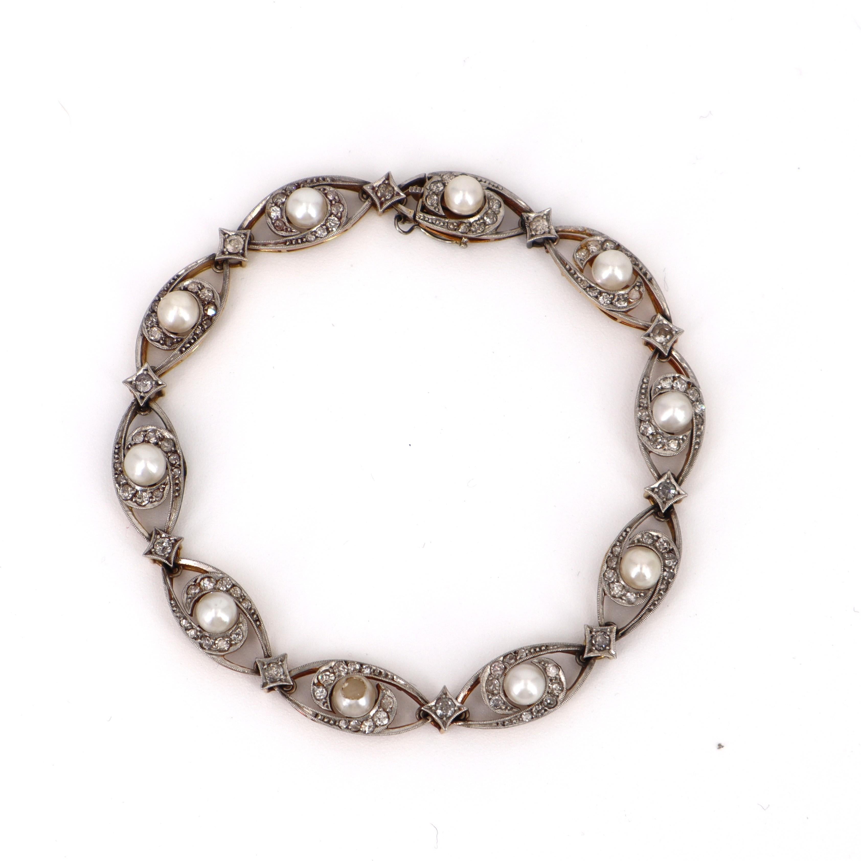 Discover the elegance of this exquisite Art Deco bracelet, a true testament to the artistry of the 1910-1930 era, expertly crafted in lustrous 18kt gold and platinum creating a striking contrast that enhances its luxurious appeal. This stunning