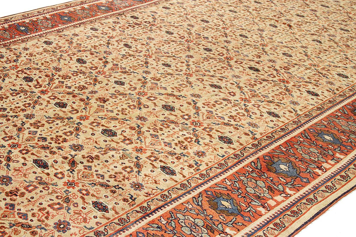 Islamic 1910 Antique Persian Sultanabad Rug with Navy & Red Floral Motif on Ivory Field For Sale