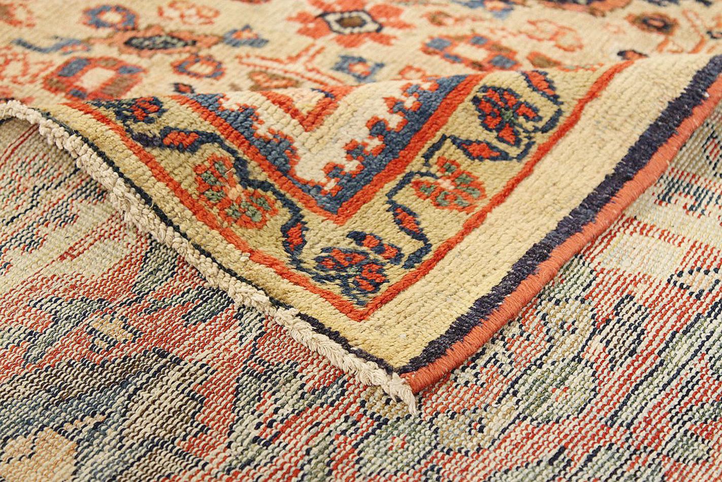 Hand-Woven 1910 Antique Persian Sultanabad Rug with Navy & Red Floral Motif on Ivory Field For Sale