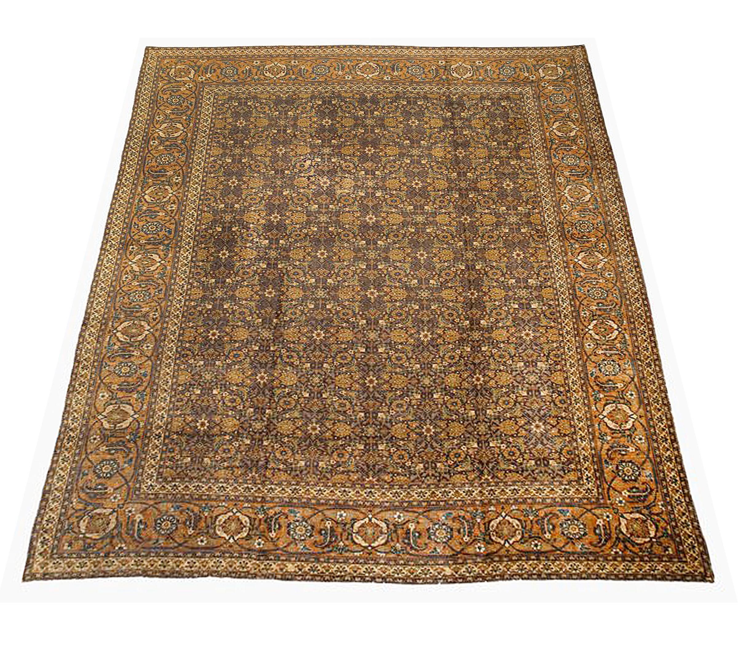 Contemporary Persian rug handwoven from the finest sheep’s wool and colored with all-natural vegetable dyes that are safe for humans and pets. It’s a traditional Tabriz weaving featuring a lovely ensemble of floral designs in beige and rust over a