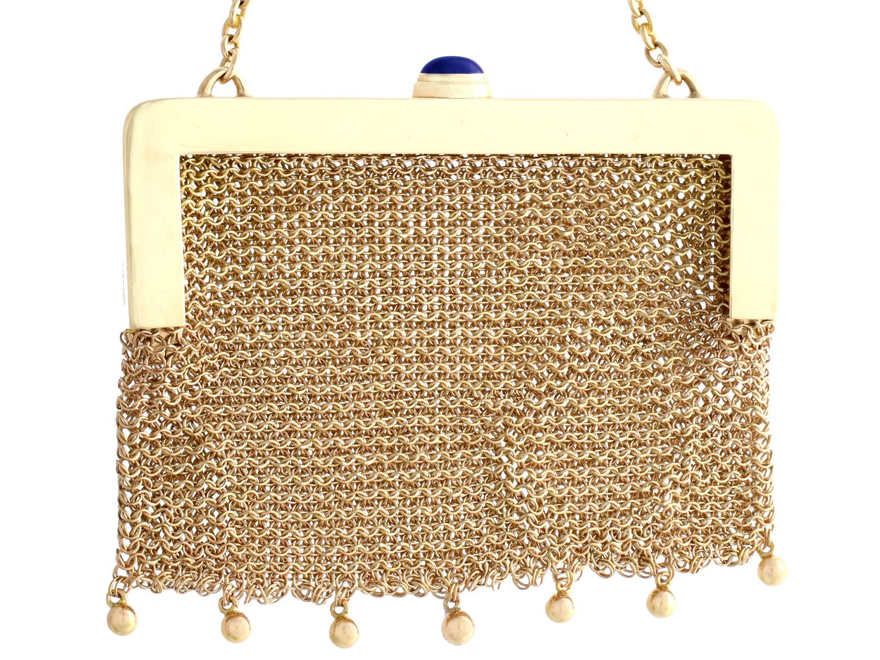 A stunning antique 0.68 carat sapphire and 0.32 carat ruby, 0.21 carat diamond and 14 karat yellow gold purse; part of our diverse antique jewelry and estate jewelry collections.

This fine and impressive antique mesh purse has been crafted in 14k