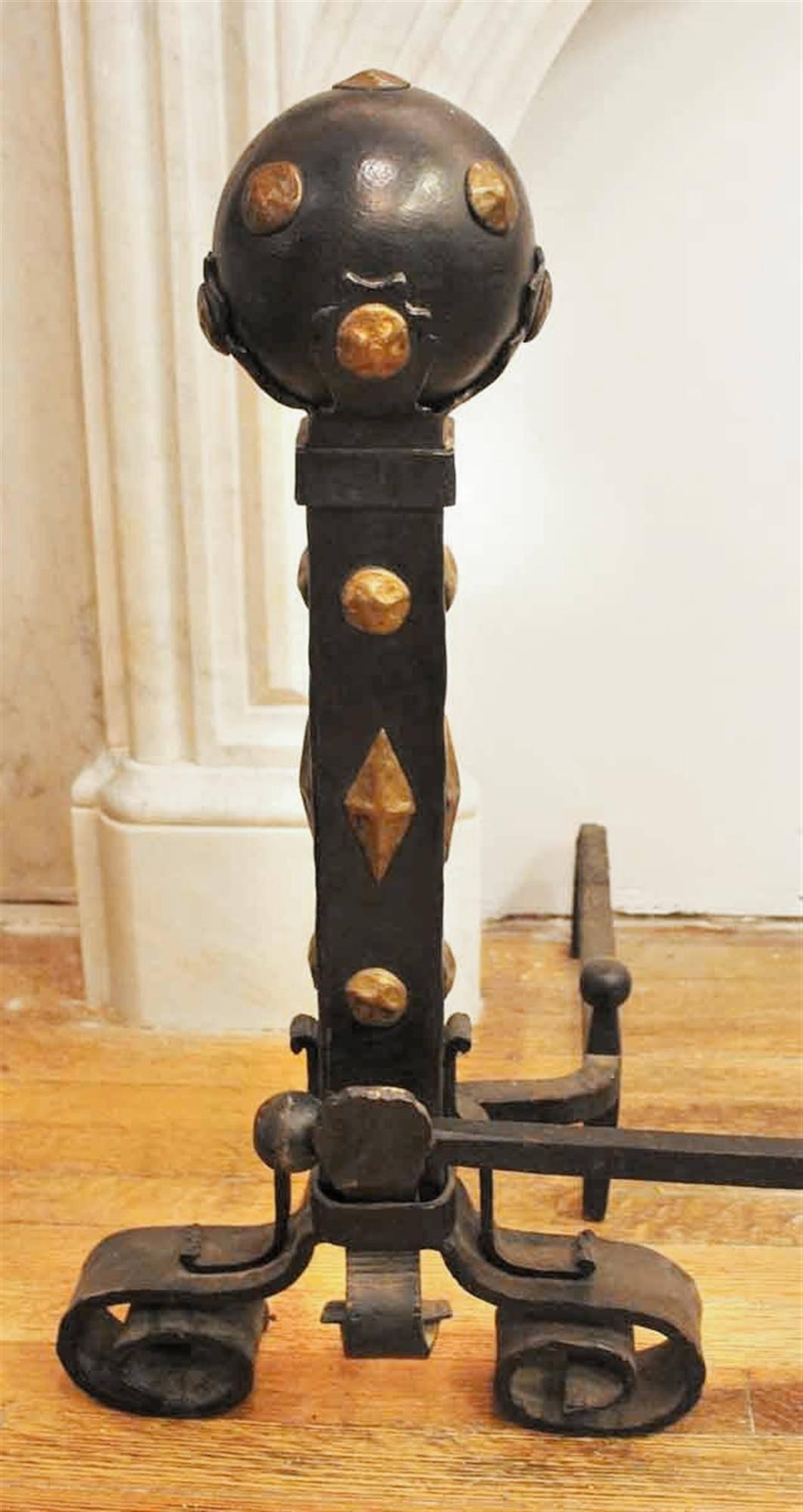 Set of 1910 Arts & Crafts brass and wrought iron andirons with a cross bar. This can be seen at our 2420 Broadway location on the upper west side in Manhattan.
