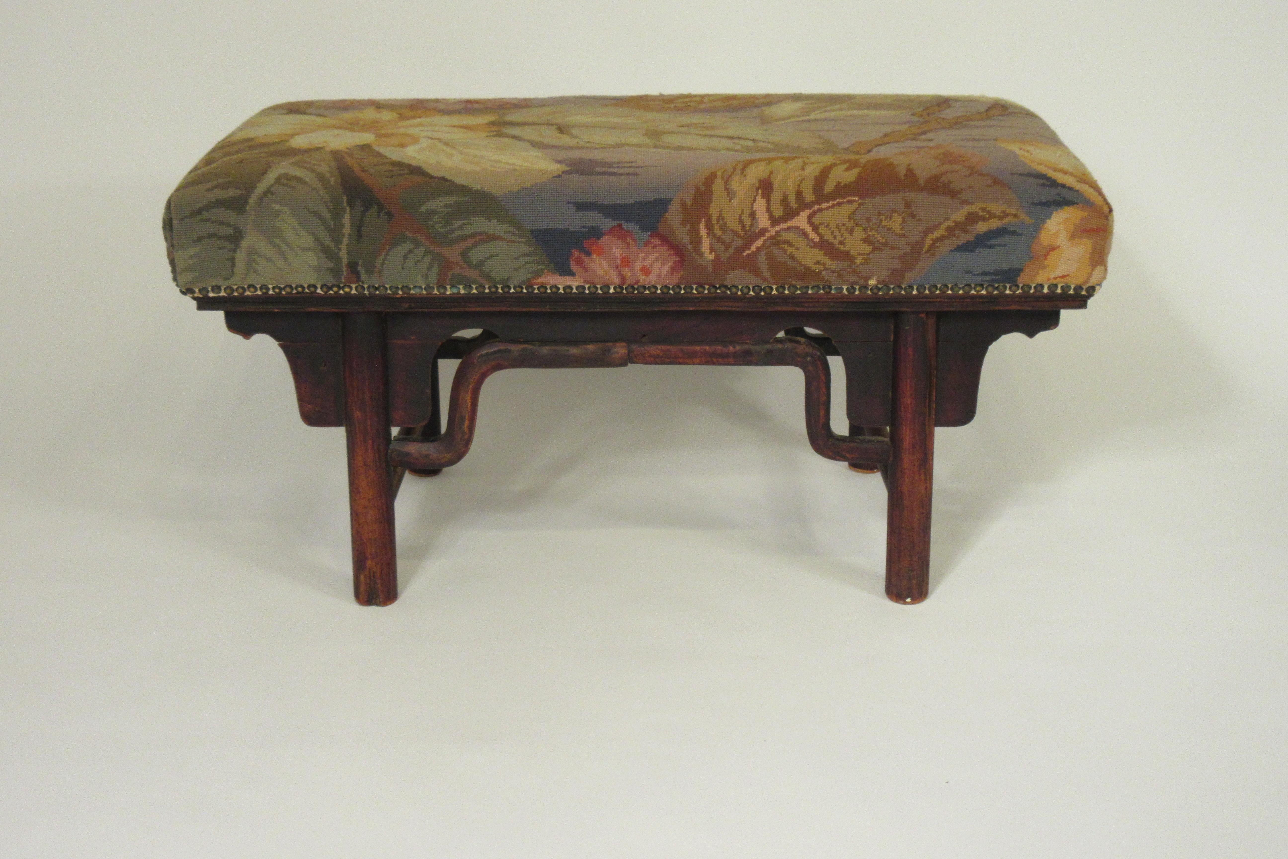 Turn of the century wood Asian bench. Original upholstery.