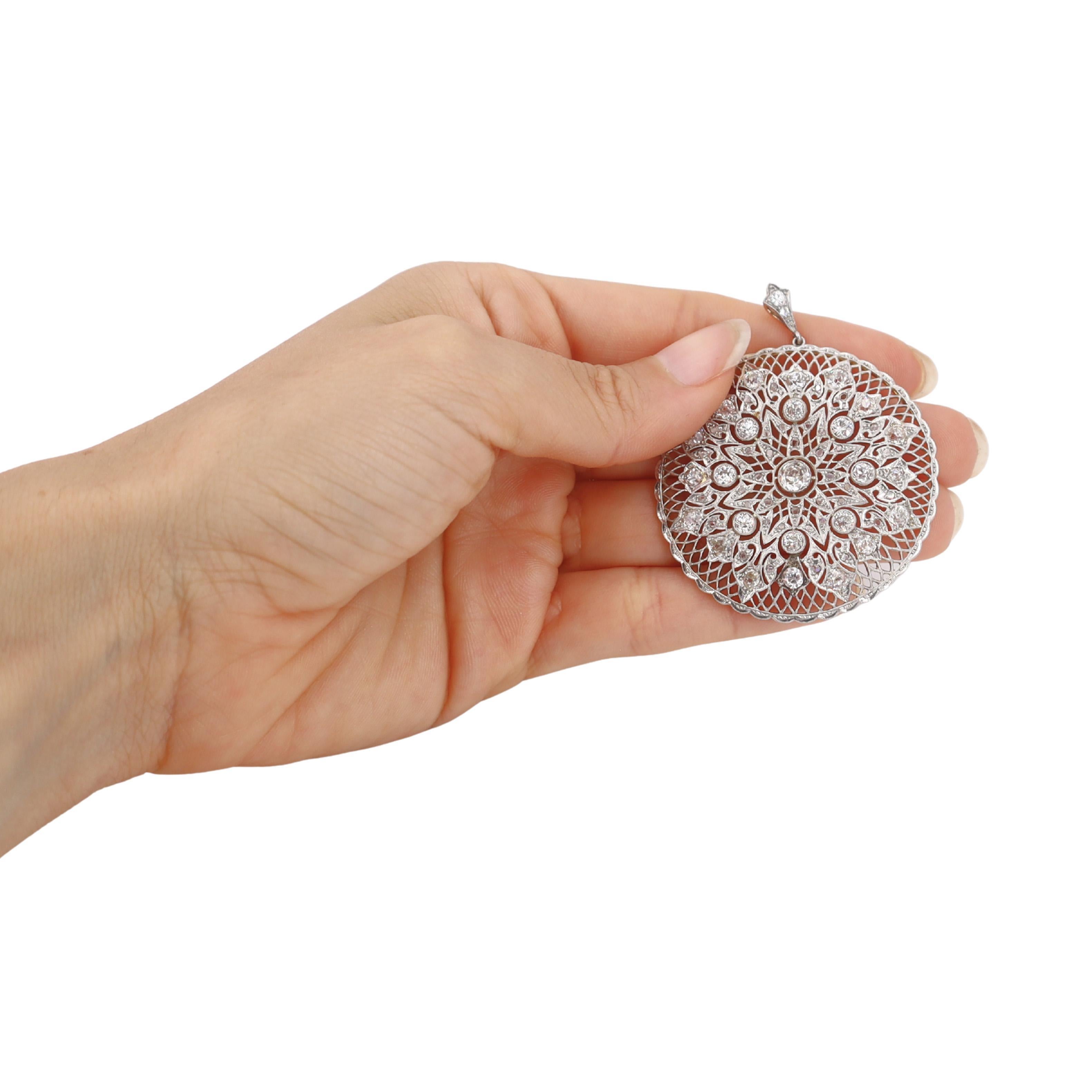This extraordinary circa 1900s Belle Epoque filigree pendant represents the pinnacle of Edwardian craftsmanship, expertly crafted in lustrous 18kt yellow gold with platinum detailing and featuring a beautiful 0.50-carat old mine diamond in J color