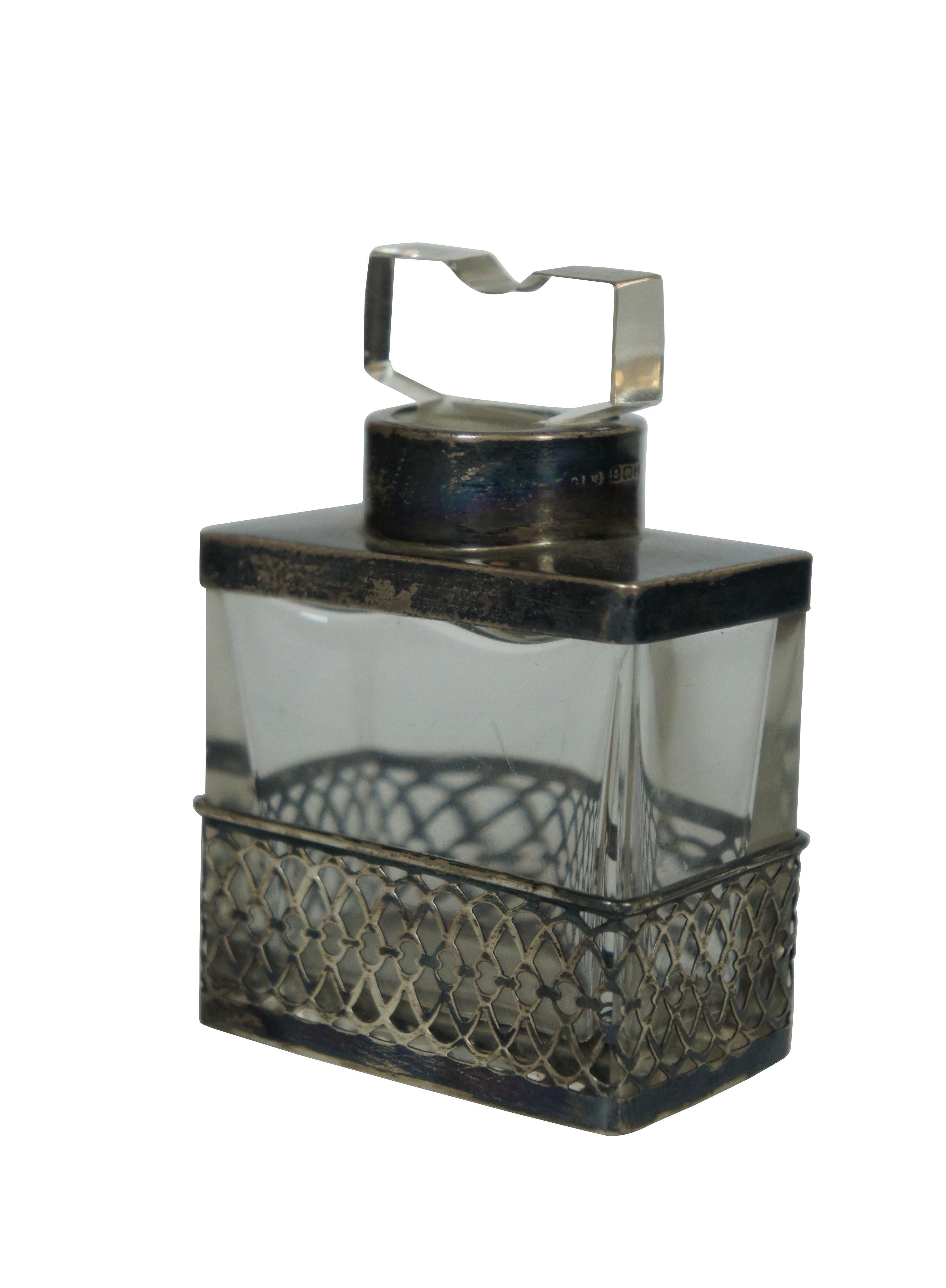 Large antique 1910 Birmingham sterling silver clad / overlay glass vanity / perfume bottle or inkwell by C.E. Williams. Features unique rectangular form with geometric stopper; solid clad at the top and pierced / reticulated design around the