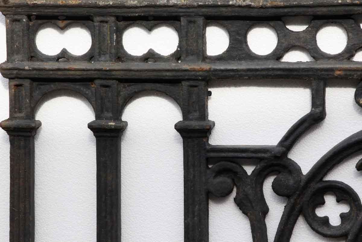 1910 cast iron balcony with a black finish and decorative detail. A small piece in the middle is broken and not connected. This can be seen at our 400 Gilligan St location in Scranton, PA.