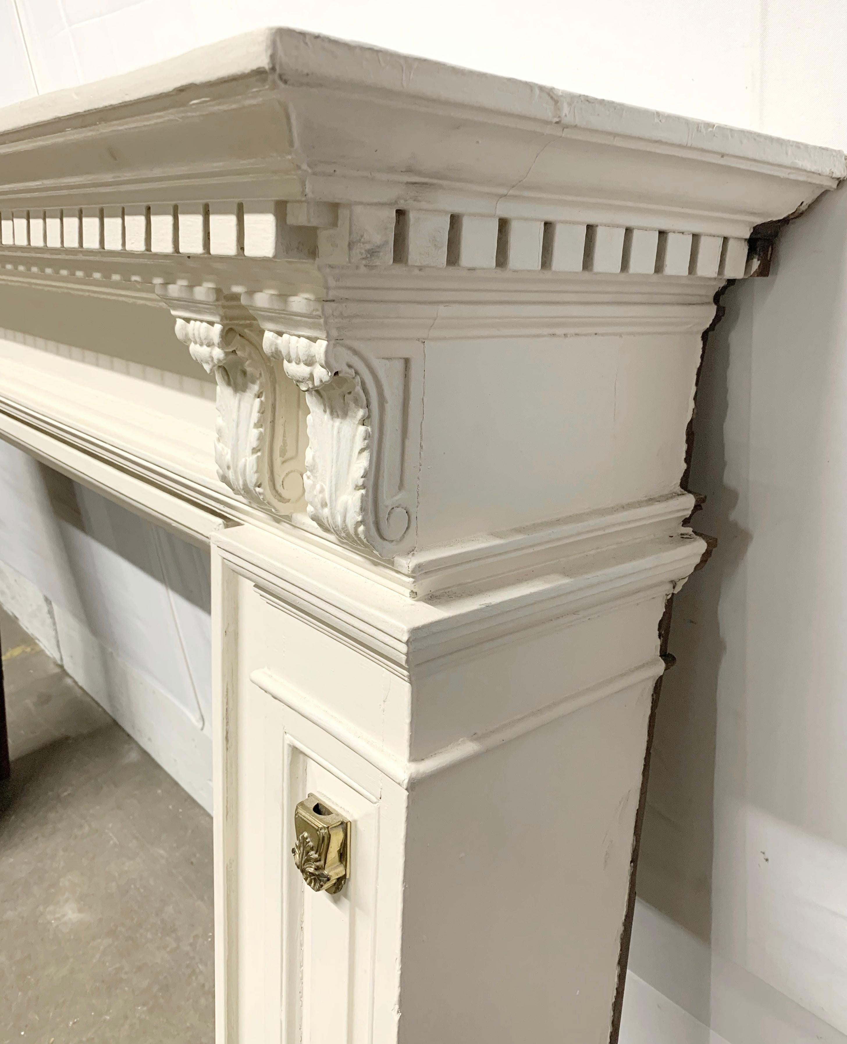 Early 20th Century 1910 Dentil Carved White Wood Mantel with Brass Details
