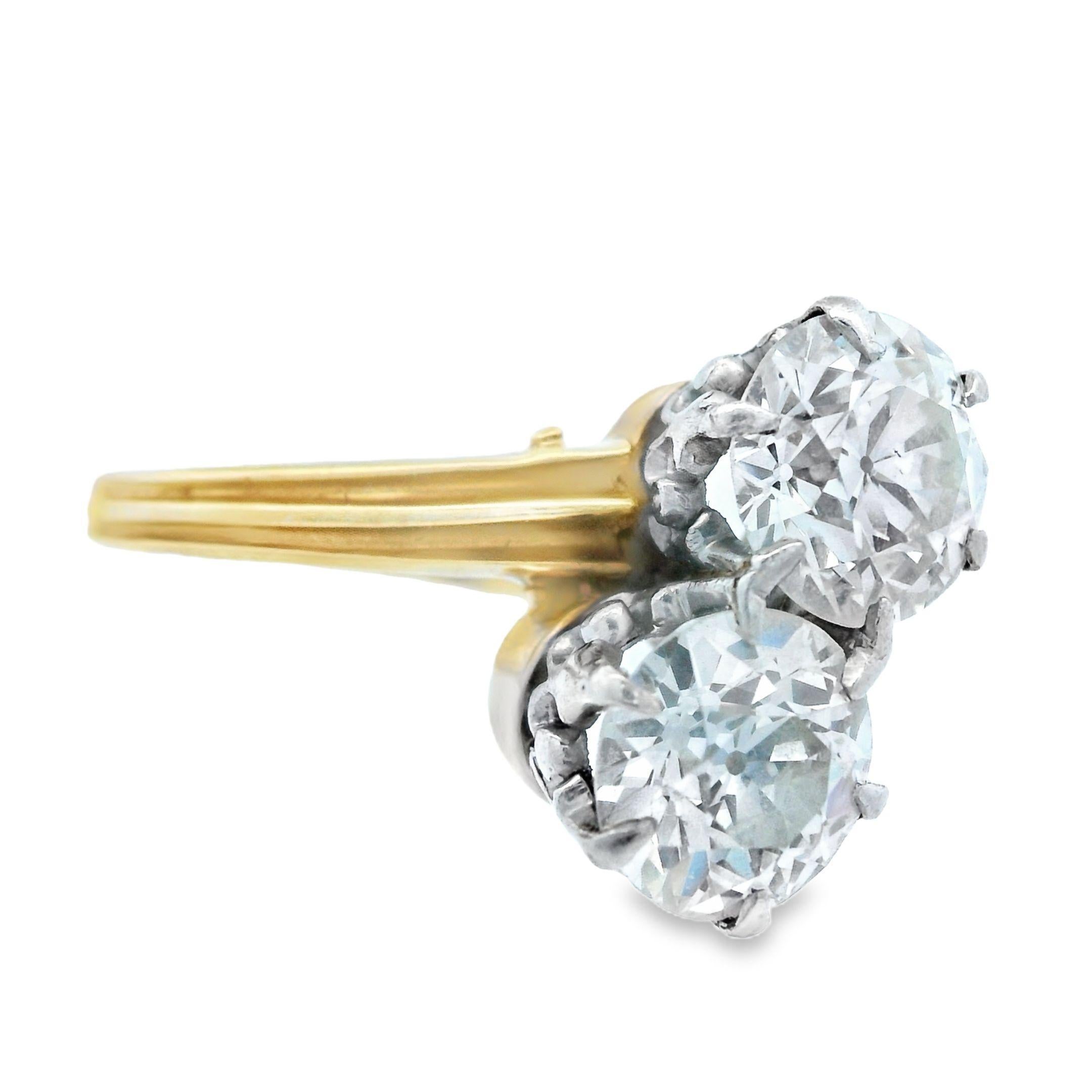 This lovely Toi et Moi ring comes from the 1910 Edwardian period and is made with 14k yellow gold and platinum with 2 carats of natural, Euro cut diamond. This Toi et Moi, meaning ‘You and Me”, gets its name from the two stones that symbolize the