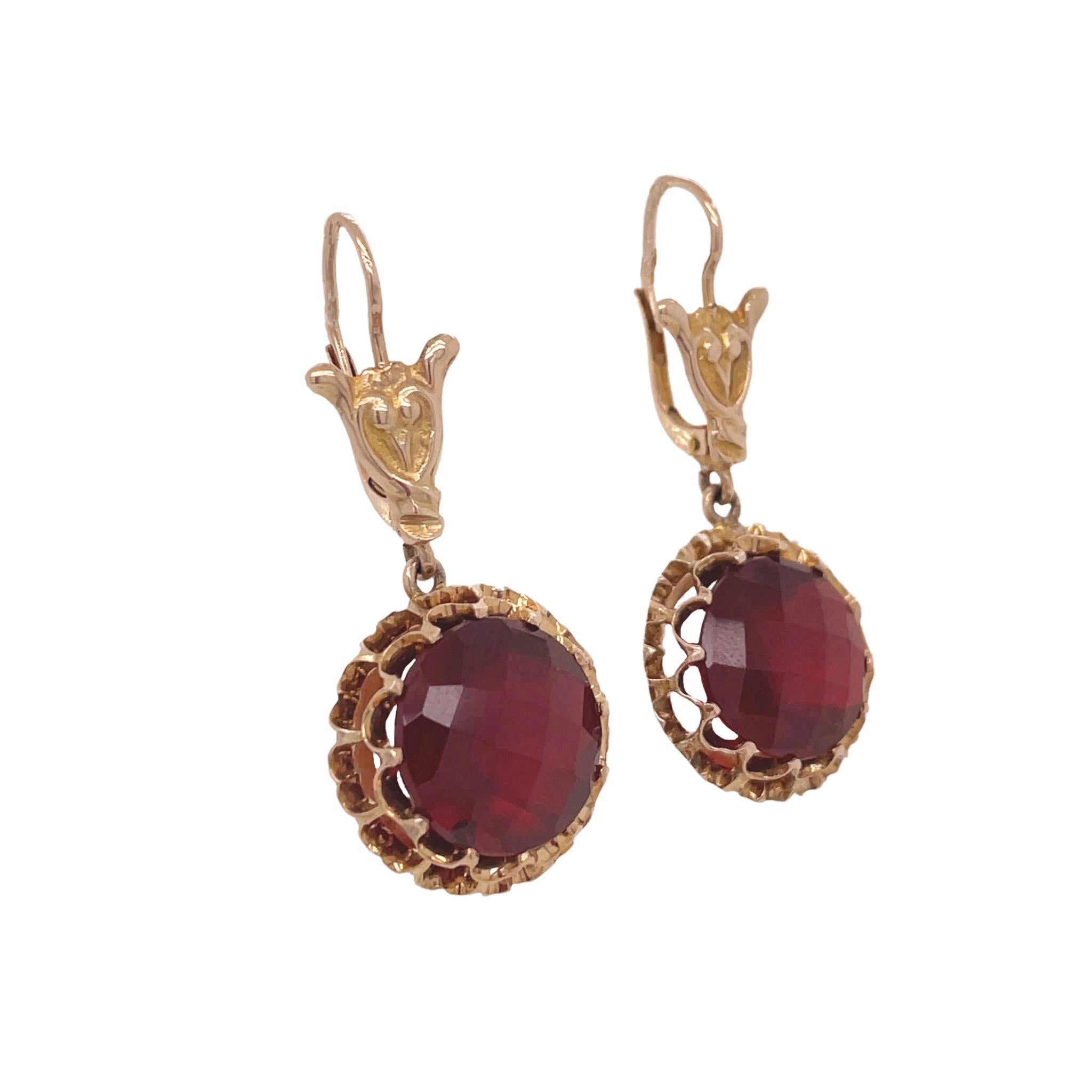 This is a pair of Edwardian Garnet earrings set in 14K Yellow Gold! Aren't these earrings just ravishing? Set in a glimmering 14K Yellow Gold are bold and beautiful rose-cut garnets that demand attention! With every movement you make, these stones