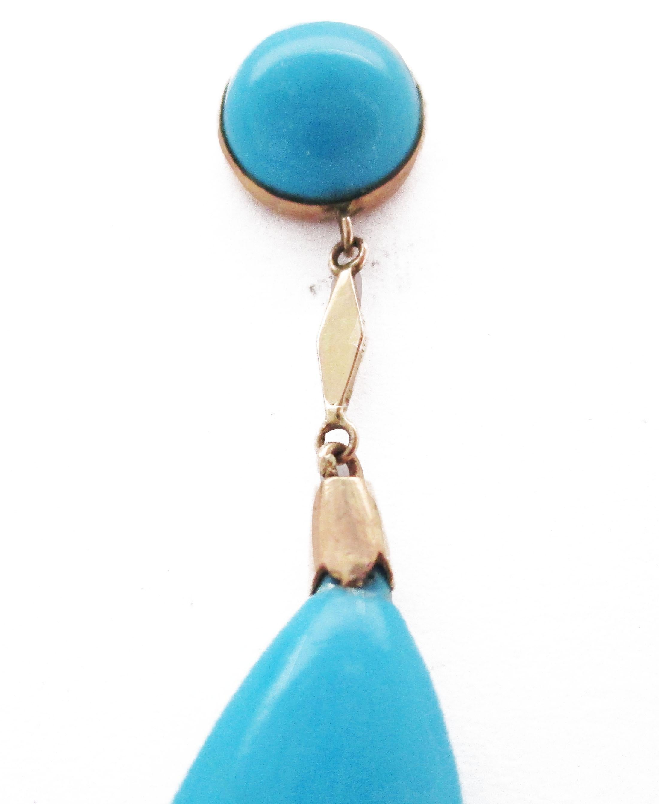 This gorgeous pair of dangle earrings are a true Edwardian treasure, with their bright 14k yellow gold and impossibly blue turquoise drops. Truly, one would have to traverse the Caribbean to find a blue as rich and enchanting as this turquoise! The