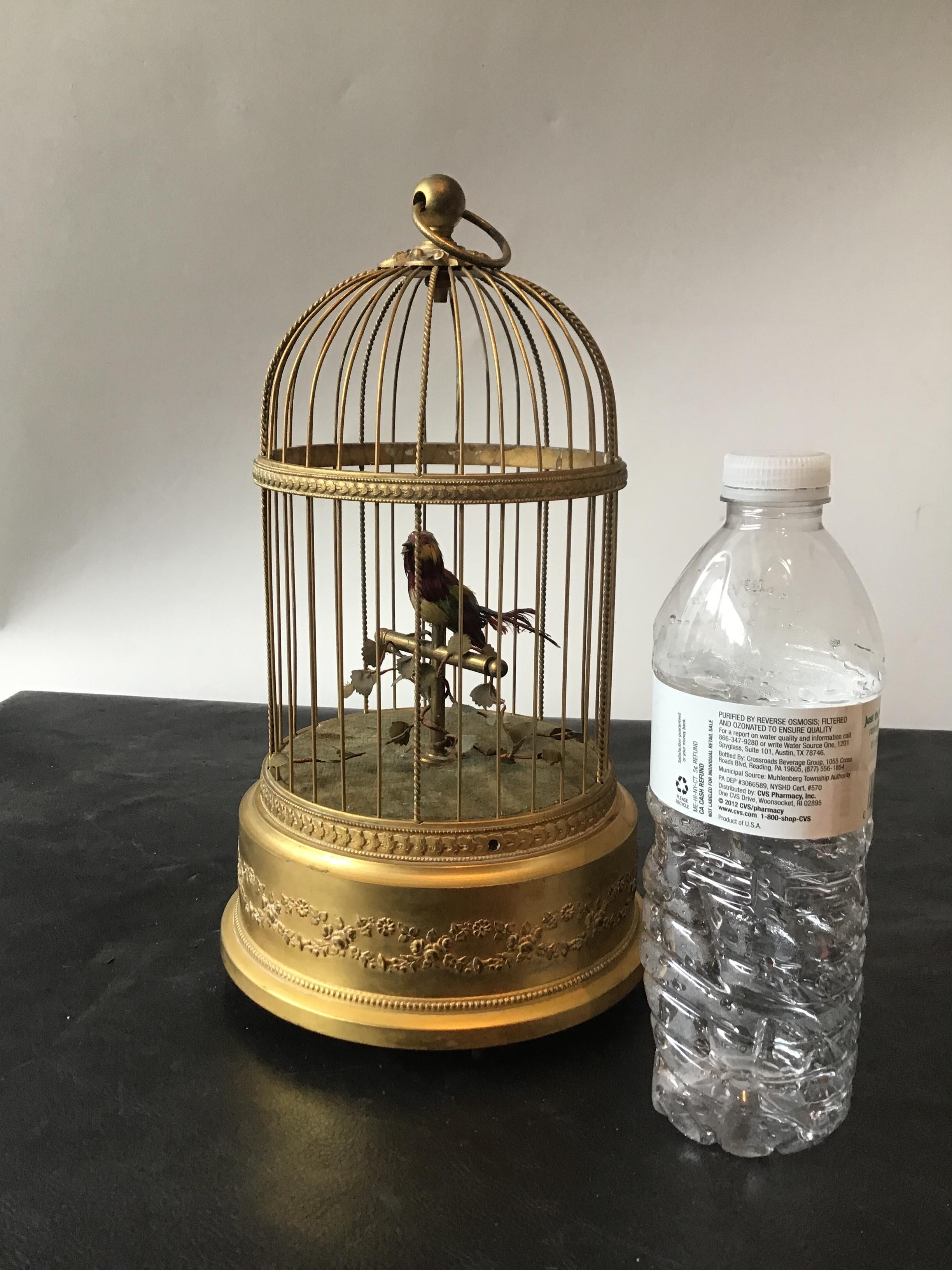 1910 Automaton singing feathered bird in brass gilt cage, marked France. Works.
The video does not provide any sound, the bird does chirp and whistle though.