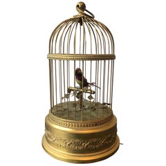 Oiseau chanteur automatique français en cage en laiton doré, 1910