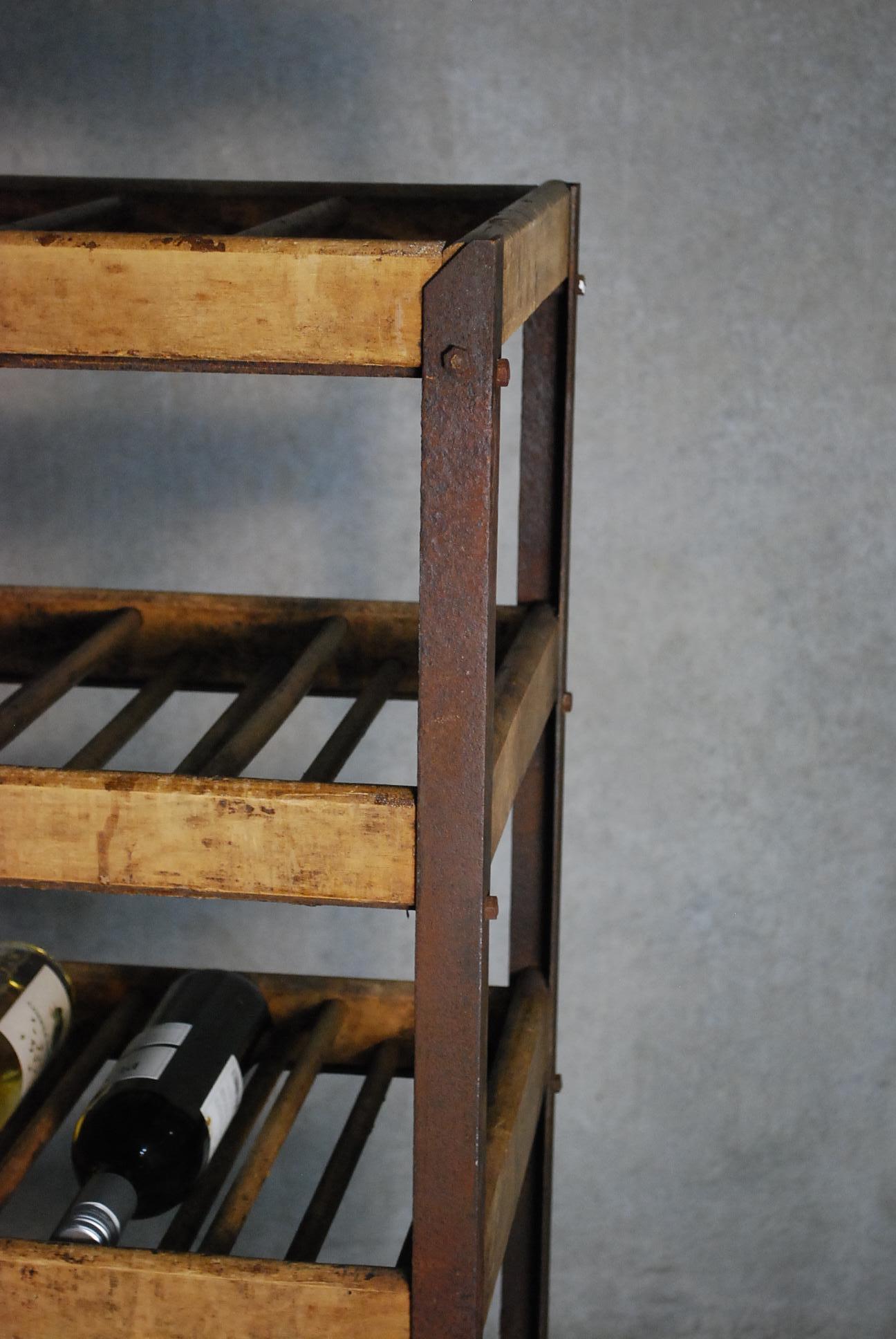 Nice working shoe rack salvaged from an early shoe factory here in Vancouver. This piece has great patina, rolling spoon wheels and tight solid construction.