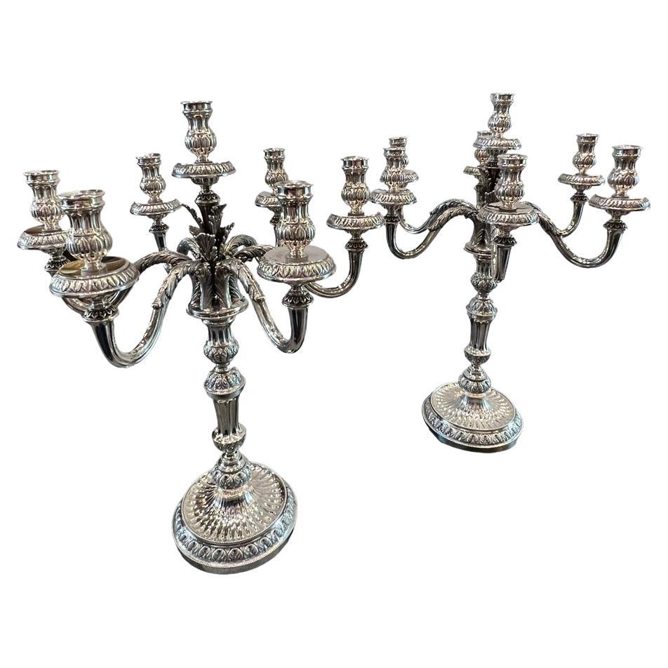 Presenting an extraordinary pair of Italian sterling silver candelabras crafted in the year 1910. These magnificent pieces, originating from the city of Florence, were meticulously created by the skilled artisans at Peruzzi Bros. Their exceptional