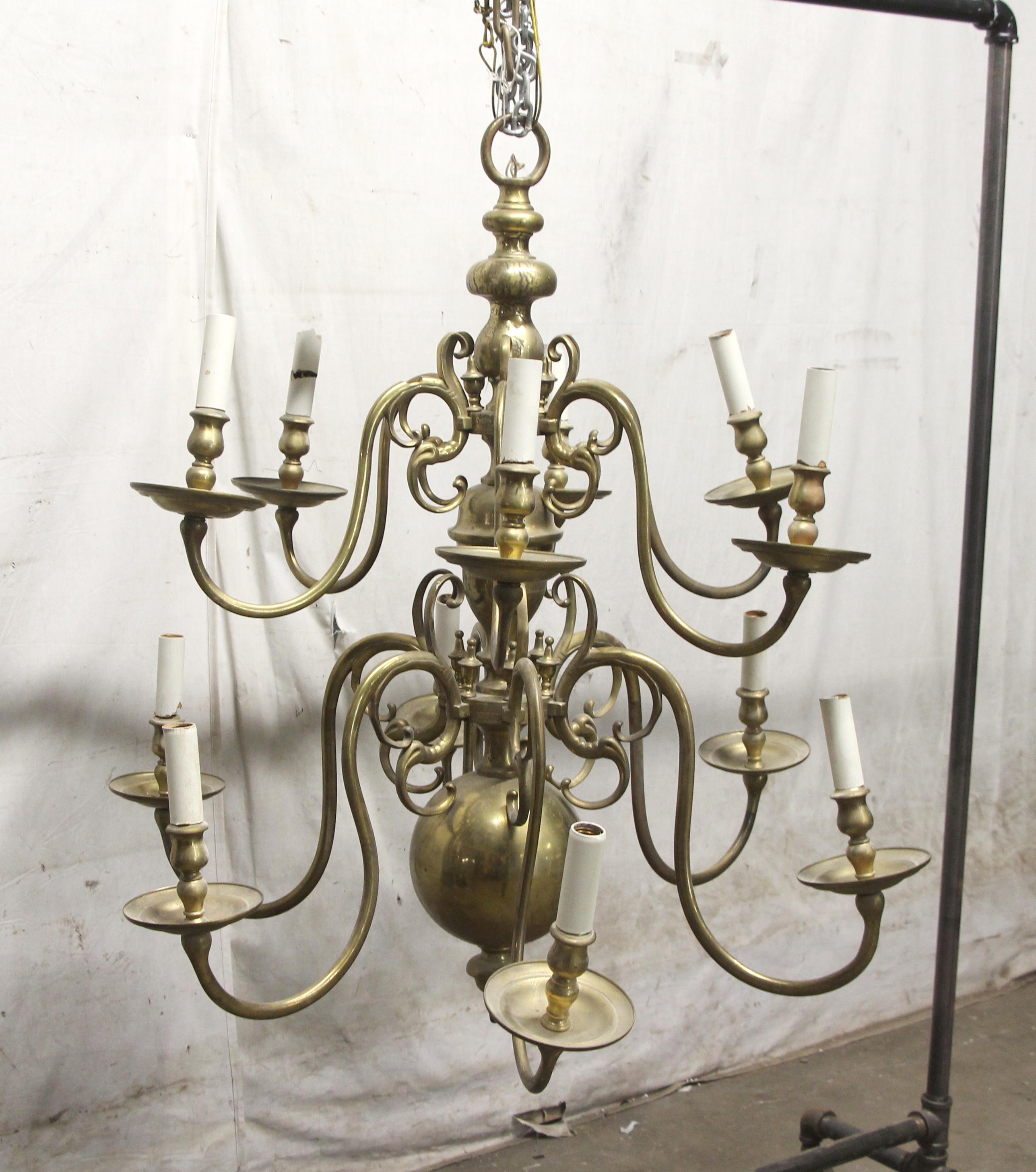 Original cast brass Williamsburg chandelier, circa 1910. It has a warm patina, but can be polished to shiny brass if desired. Price includes rewiring, cleaning without removing the original patina and adjusting the position of the arms. This can be