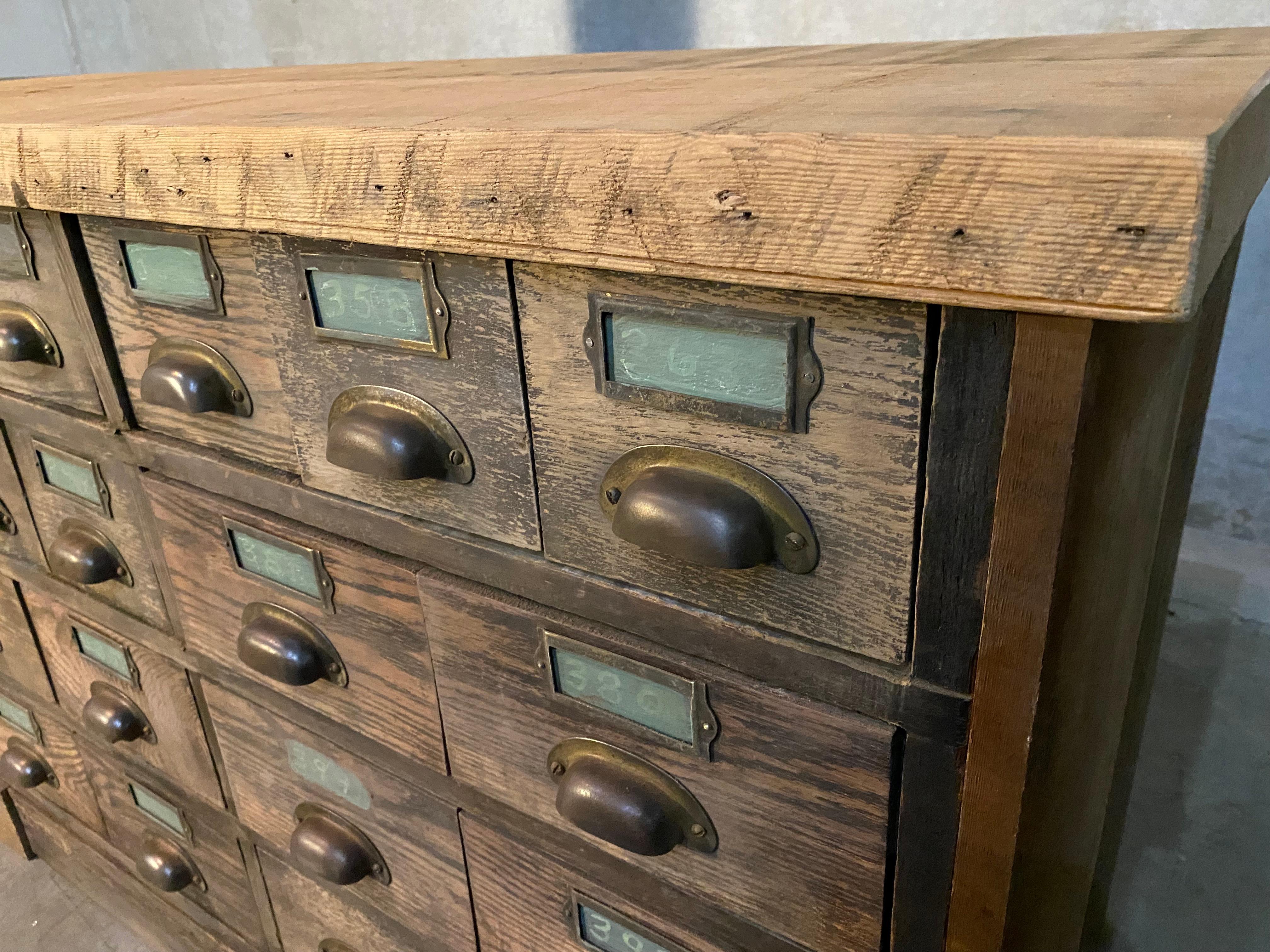 Great early cabinet from mid west with multiple drawers lined in zinc with original handles and hardware. This old beauty was in a hardware store for years , salvaged in the 1970's and recenty picked from a shed. The case is solid as we added a