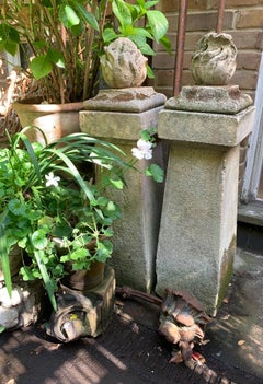 1910 pair of stone posts with flame finials