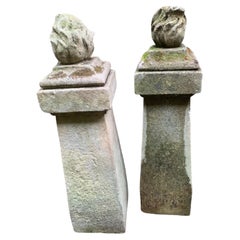 1910 pair of stone posts with flame finials
