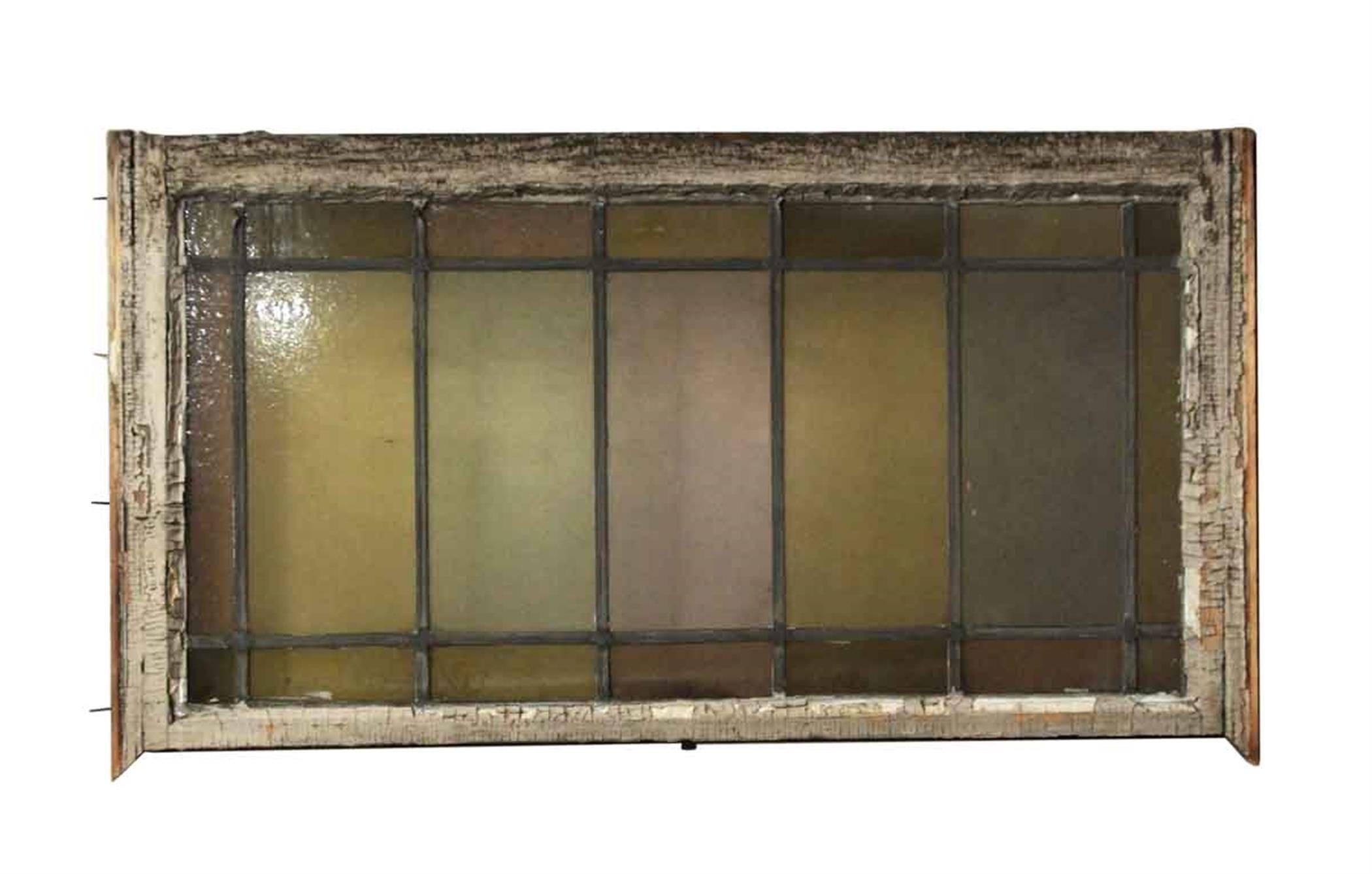 1910 reclaimed stained glass window with pastel colored glass. Shows wear. Priced each. Eight available at time of posting. Small quantity available at time of posting. Please inquire. Priced each. This can be seen at our 400 Gilligan St location in
