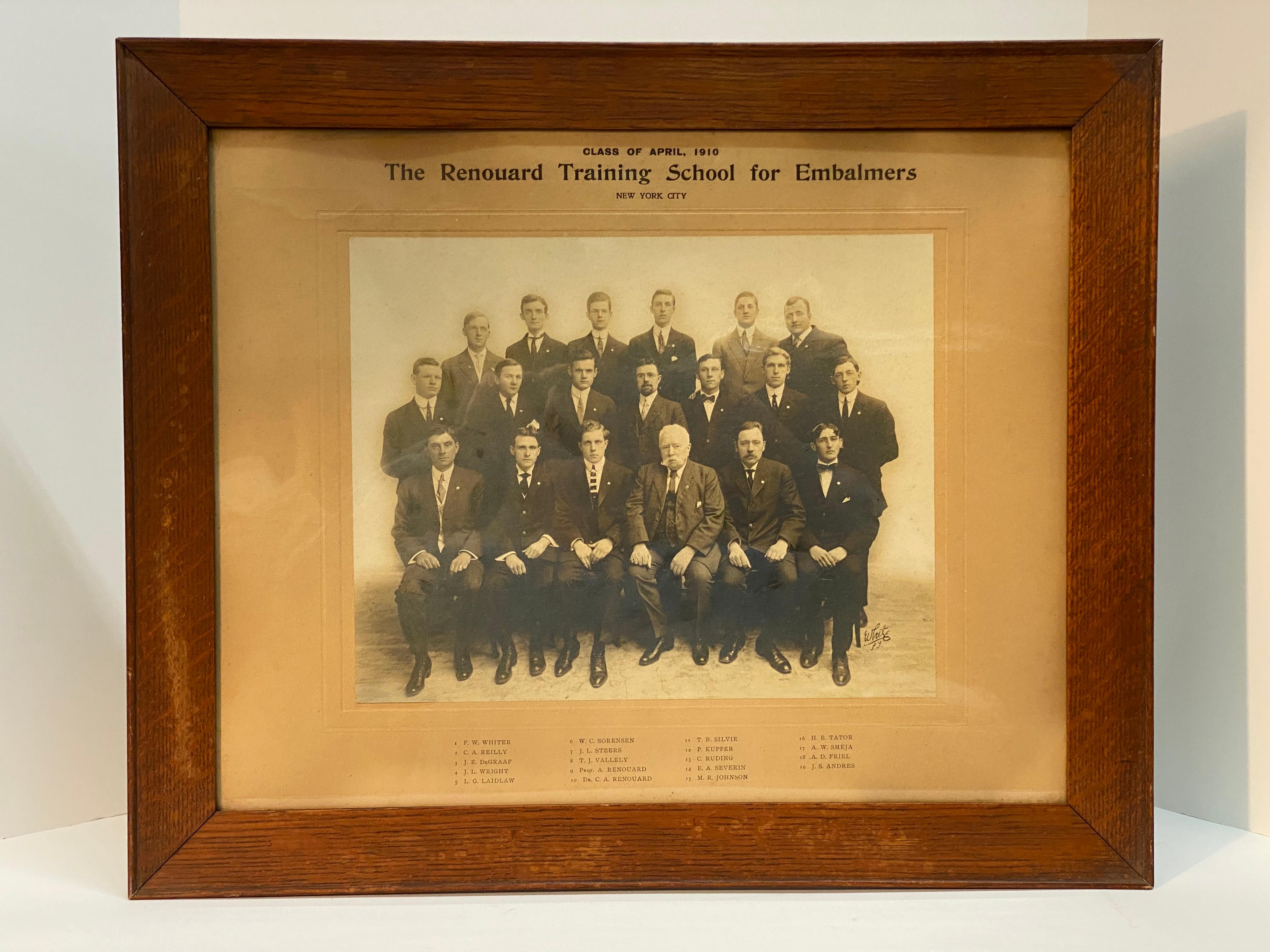 A veritable who's who of turn of the 20th Century embalmers. These fine career men depicted in black and white photography, circa 1910. The photograph is signed lower right, E(?) White, NY The framing treatment consists of a solid oak frame under