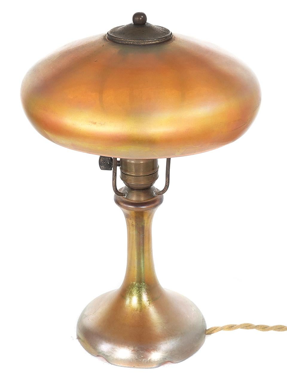 This Frederick Carder Steuben lamp is a gem and I have owned this example for over 40 years. It is all original with a new cord and plug. The patina is original as well.