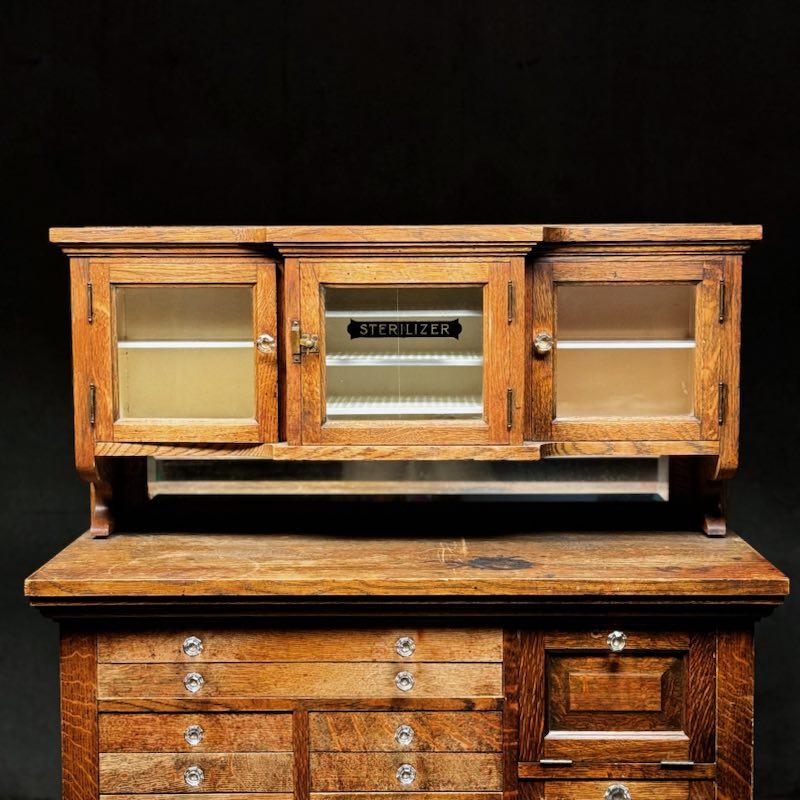 Canadian 1910 tiger oak apothecary dental multi drawer cabinet