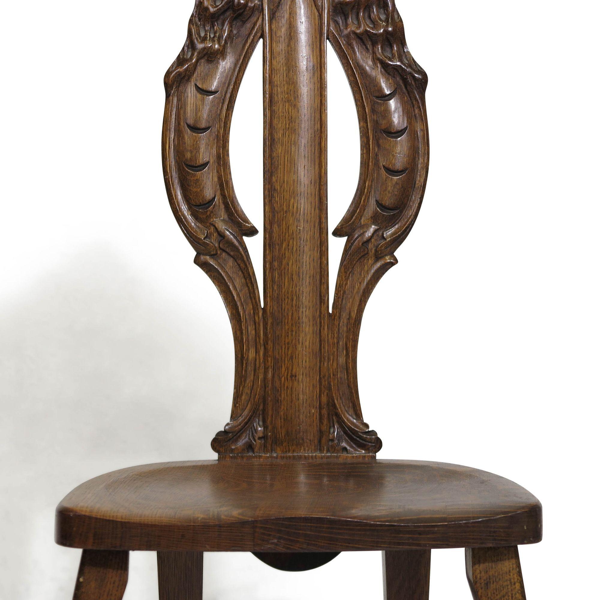 American hand-carved chair with northwind motif, circa 1910, United States.
Measurements W 15.50'' x D 18.50'' x H 42.50''
Seat Height 17.50