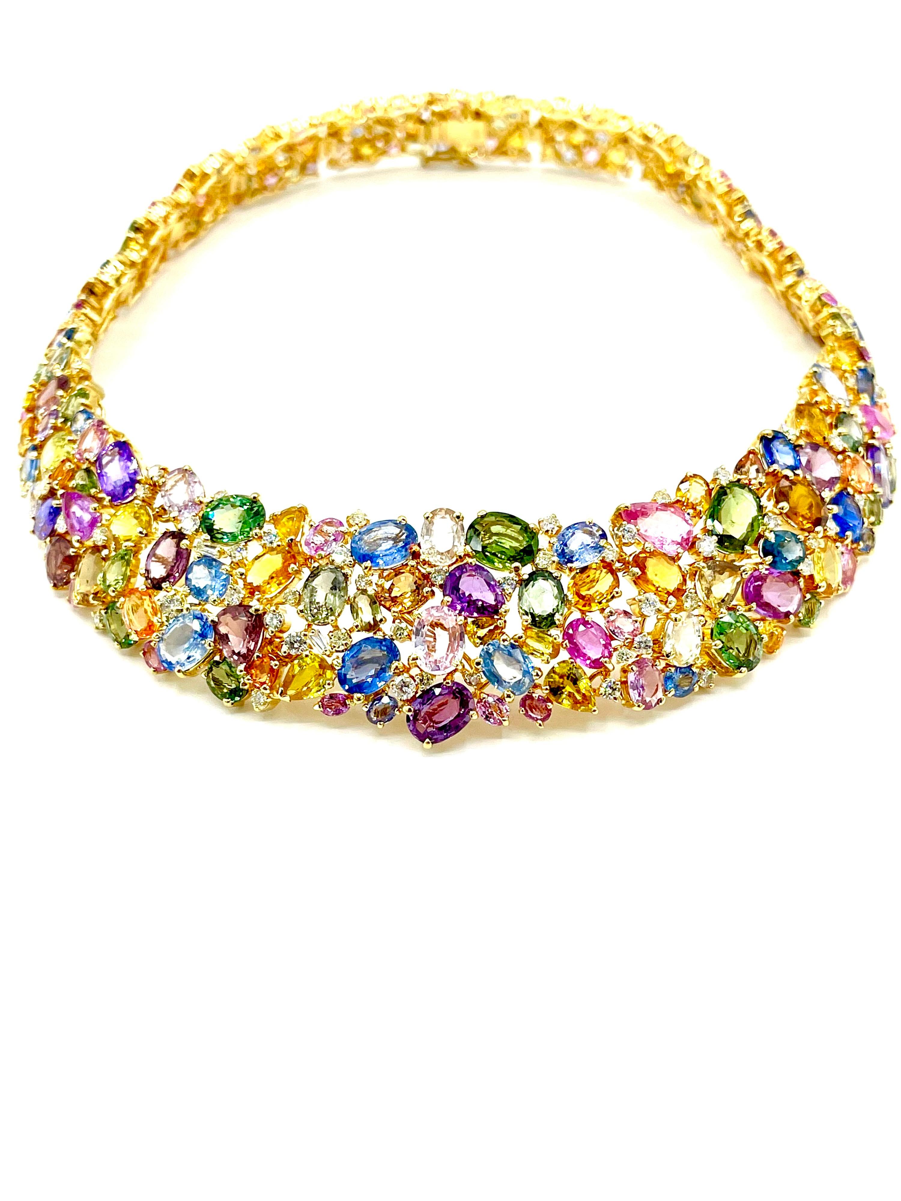 This necklace is a show stopper!  There are a total of 255 multi color Natural Sapphires of various shapes and sizes, set with 111 round brilliant white Diamonds in 18K yellow gold.  It is a masterpiece of craftsmanship.  The Sapphires range in