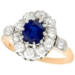 1910s 1.18 Carat Sapphire and Diamond Yellow Gold Cluster Ring