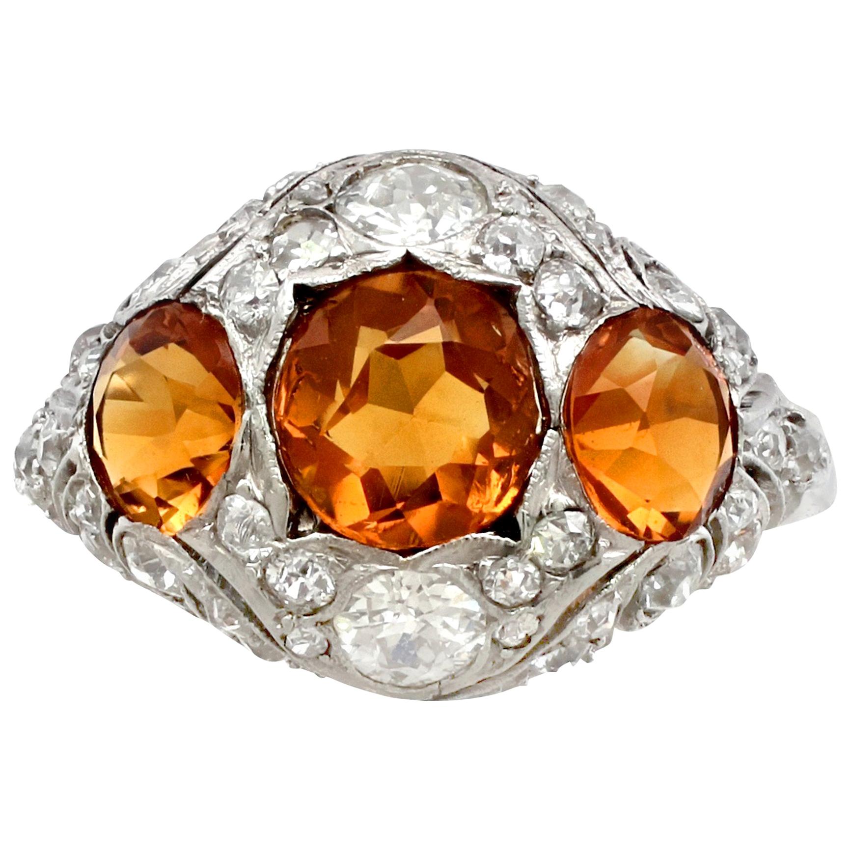 A fine and impressive antique 2.55 carat citrine and 0.66 carat diamond dress ring; part of our antique jewelry and estate jewelry collections.

This fine original antique citrine ring has been crafted in 14k white gold.

The impressive domed