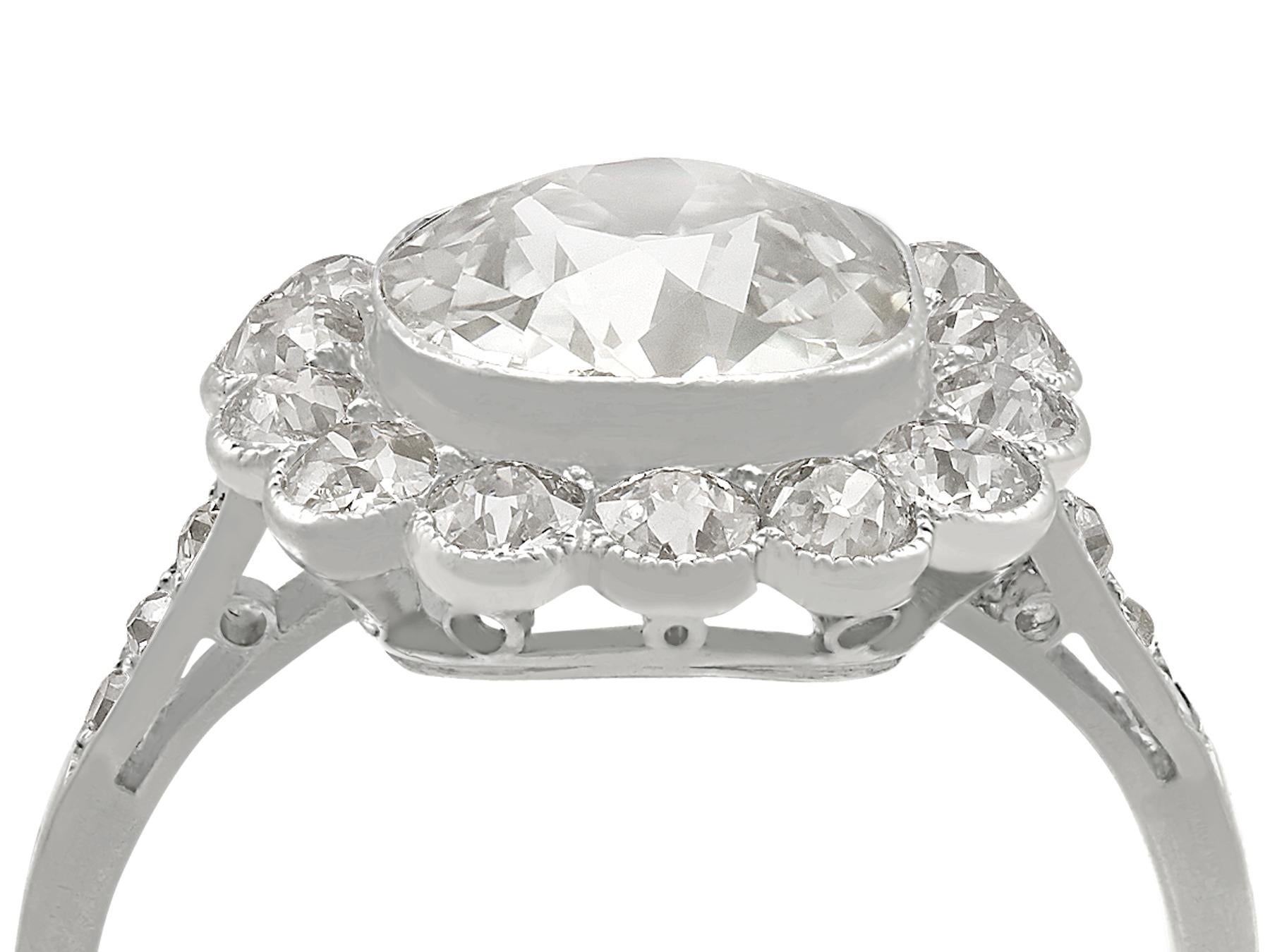 A stunning, fine and impressive antique 4.47 carat diamond and platinum cluster ring; part of our collection of antique diamond rings

This stunning antique diamond cluster ring has been crafted in platinum.

The platinum pierced decorated frame