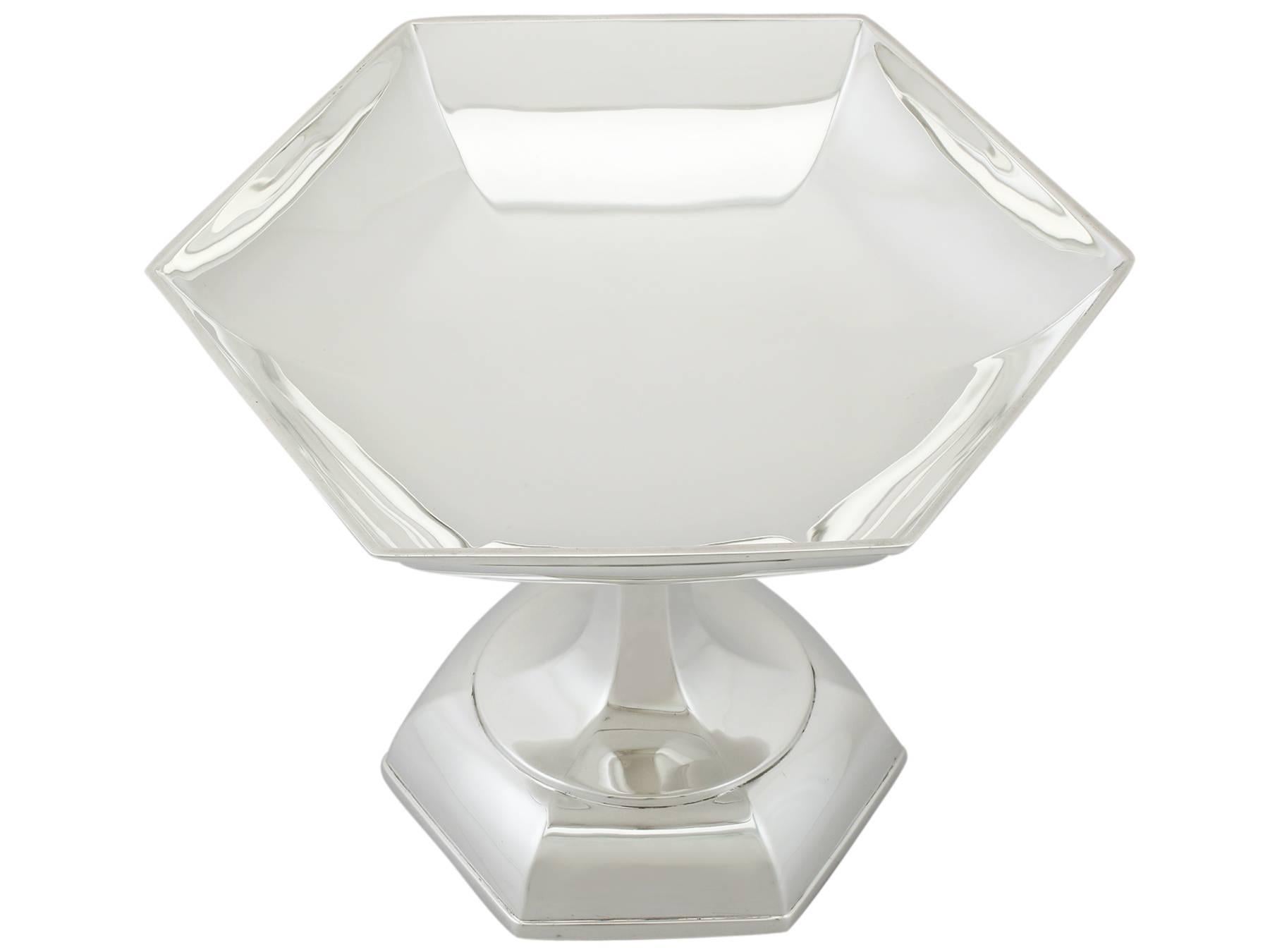 An exceptional, fine and impressive antique George V English sterling silver tazza (pedestalled dish) by Walker and Hall in the Art Deco style; an addition to our Art Deco silverware collection.

This exceptional antique George V sterling silver