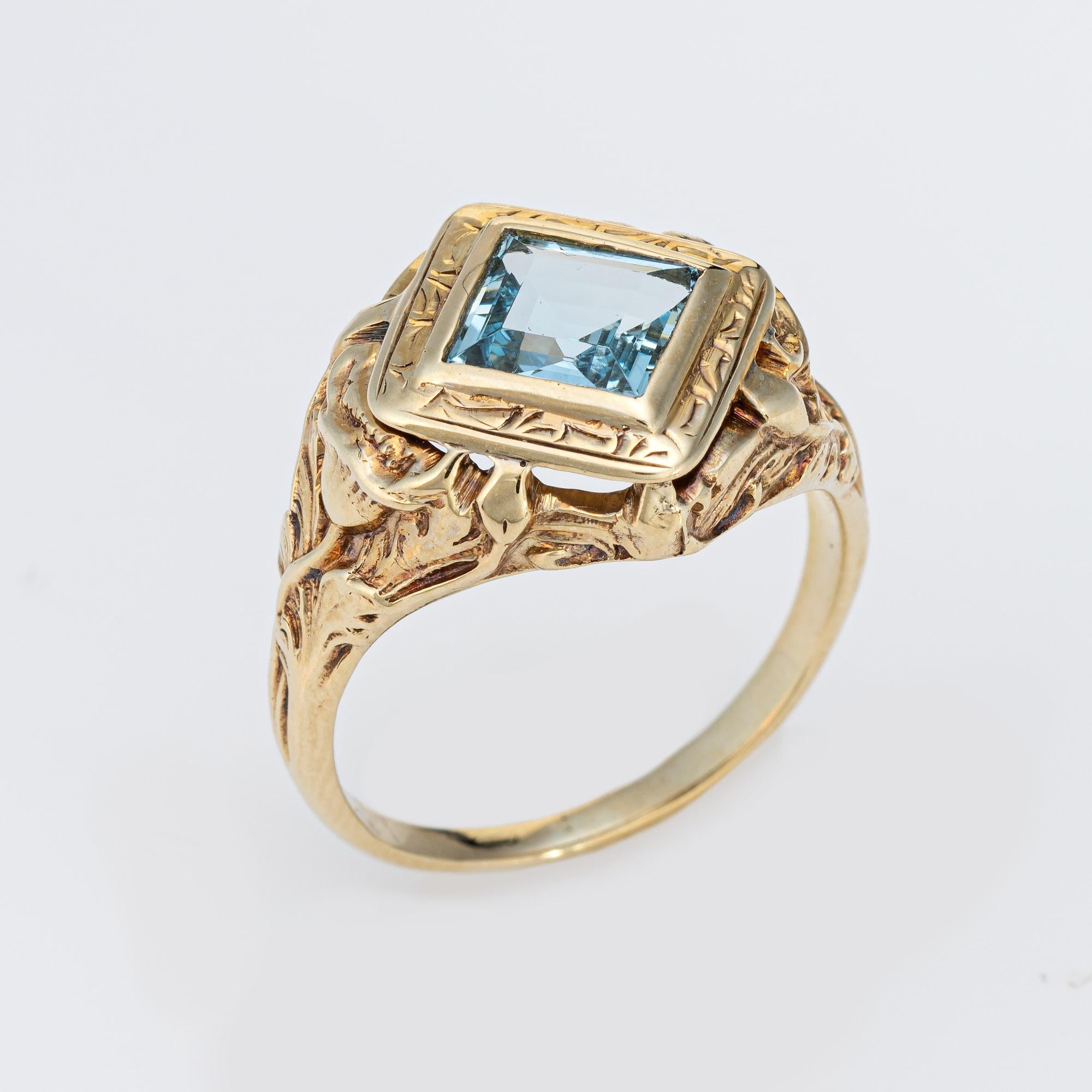 Stylish and finely detailed Art Nouveau aquamarine ring crafted in 10 karat yellow gold (circa 1910s).

Aquamarine measures 6.5mm. The aquamarine is in very good condition and free of cracks or chips. Note: the aquamarine is a later addition to the