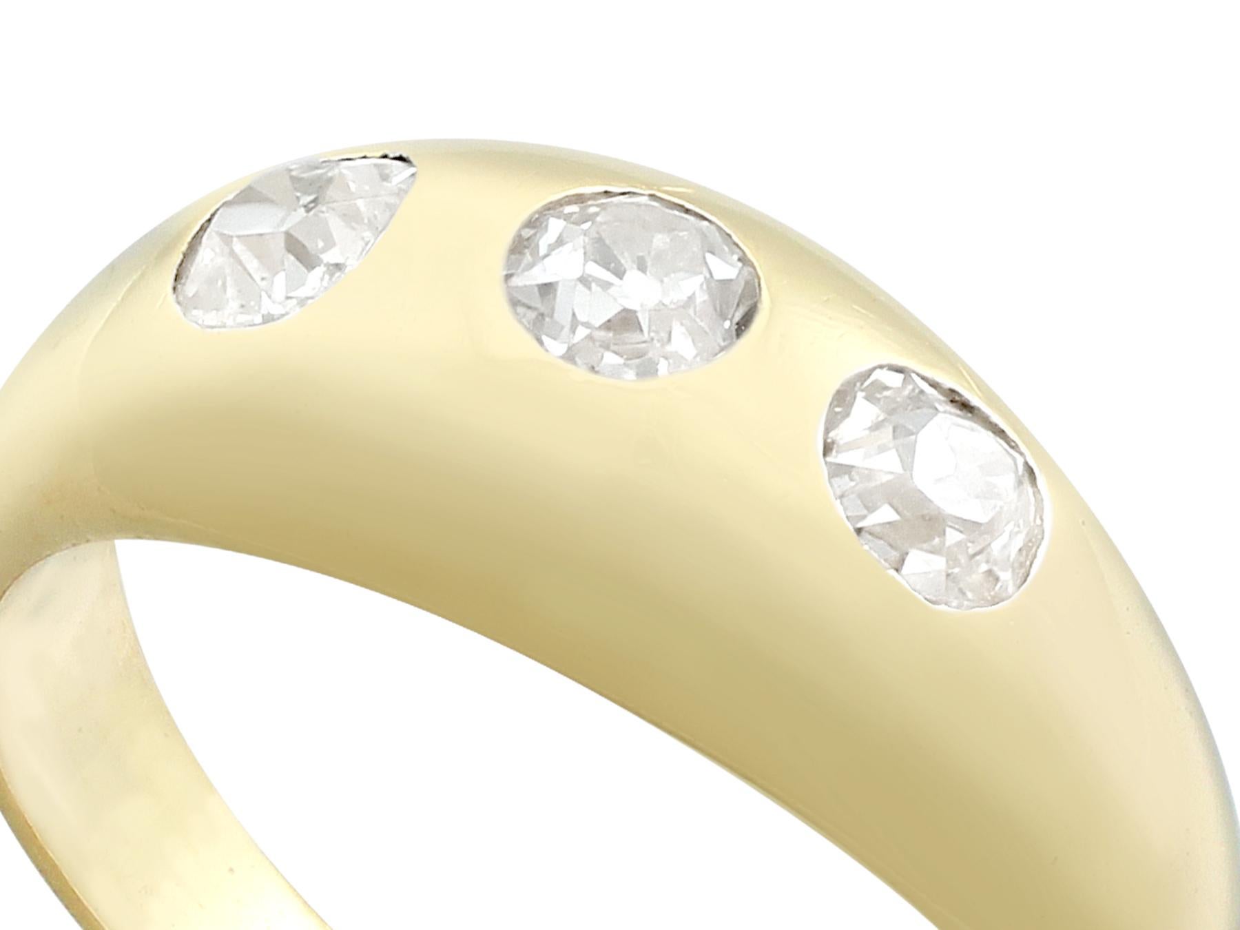 An impressive antique gent's 0.61 carat diamond and 14 karat yellow gold trilogy style dress ring; part of our diverse antique jewelry and estate jewelry collections.

This fine and impressive men's diamond ring has been crafted in 14k yellow