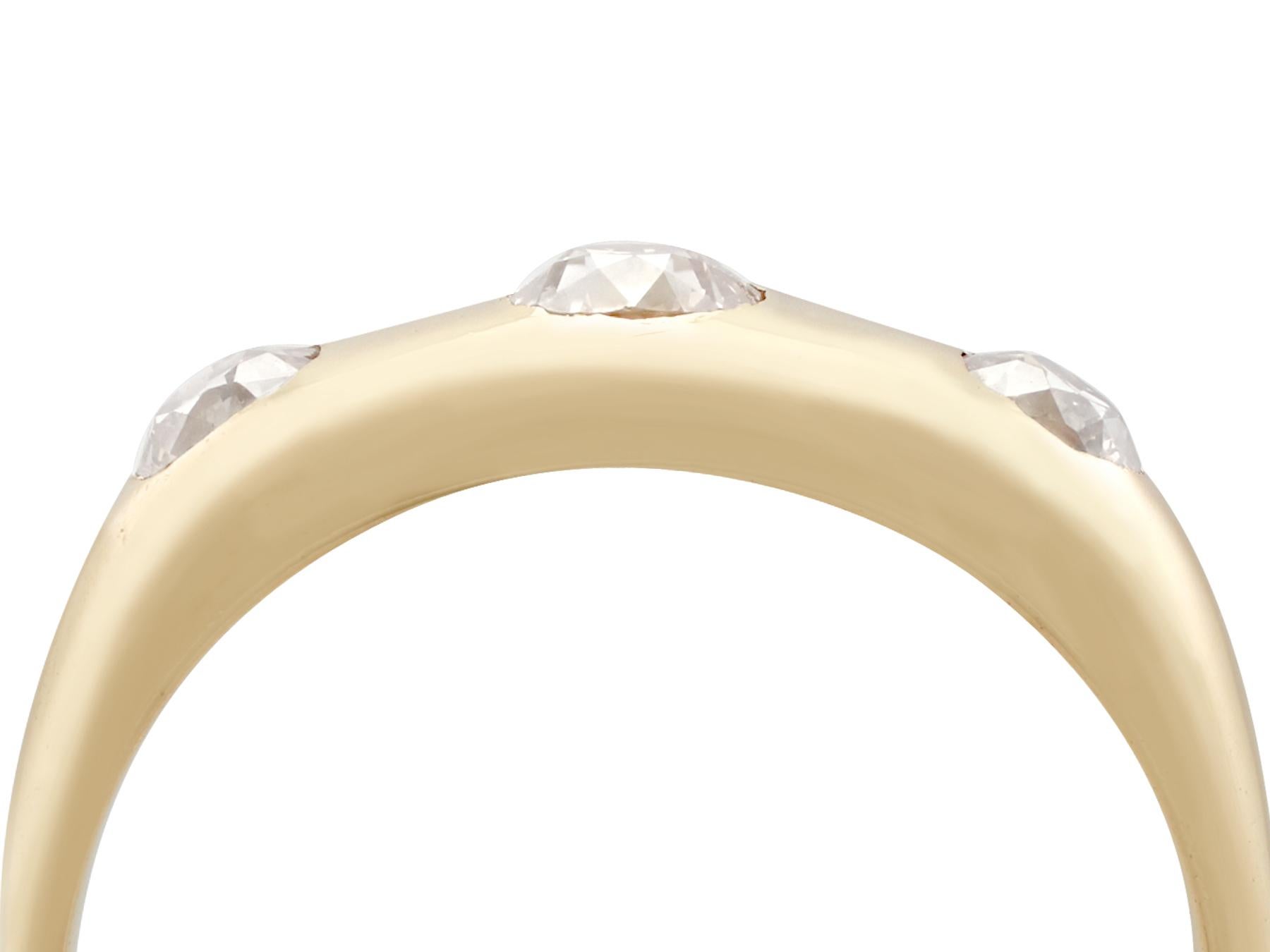 An impressive antique gent's 0.96 Ct diamond and 18k yellow gold dress ring; part of our diverse antique jewelry and estate jewelry collections.

This fine and impressive gent's three stone diamond ring has been crafted in 18k yellow gold.

The