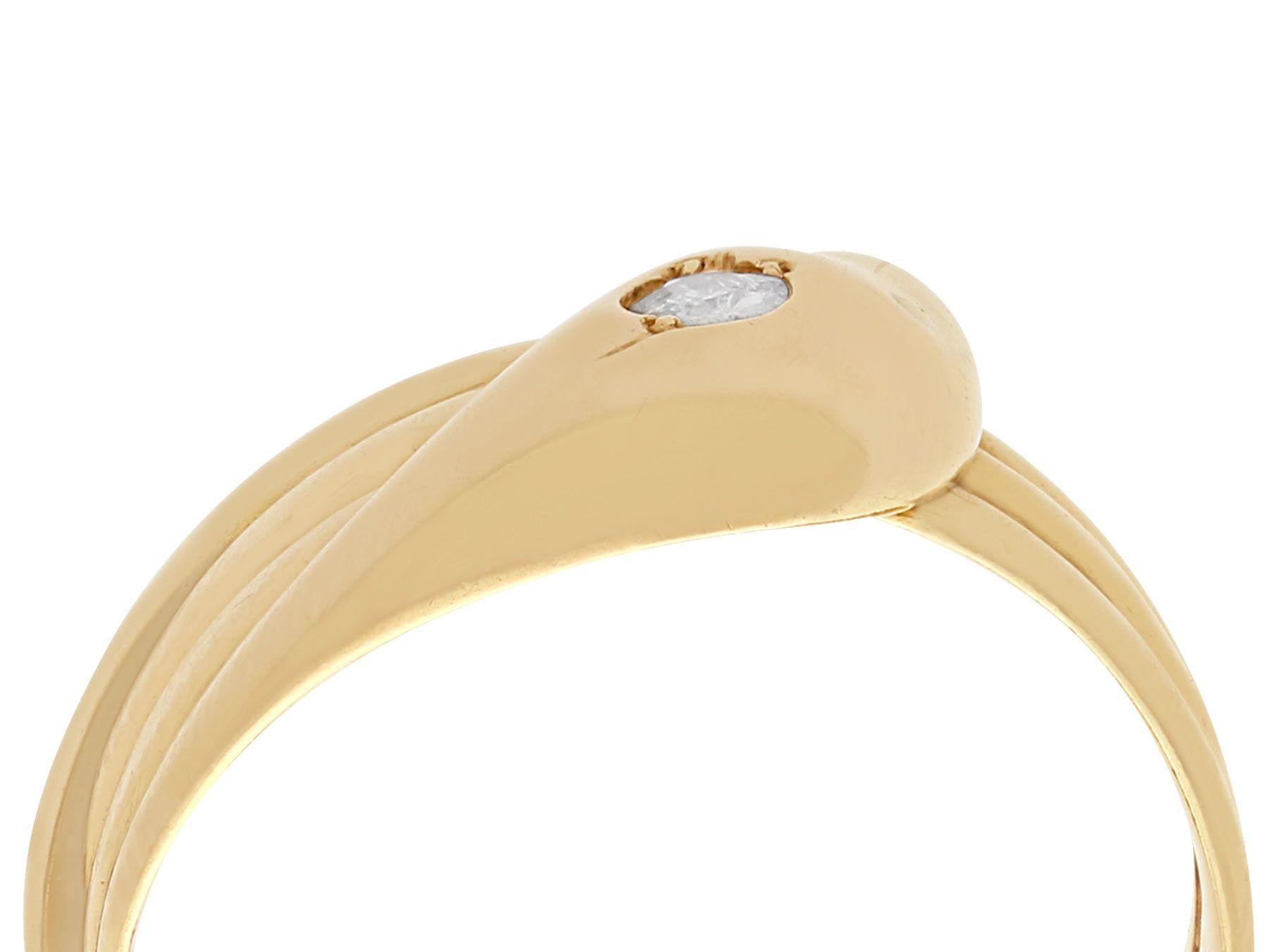 A fine and impressive English antique 0.03 carat diamond, 18 karat yellow gold snake ring; part of our diverse antique jewelry and estate jewelry collections.

This fine and impressive antique snake ring has been crafted in 18k yellow gold.

This